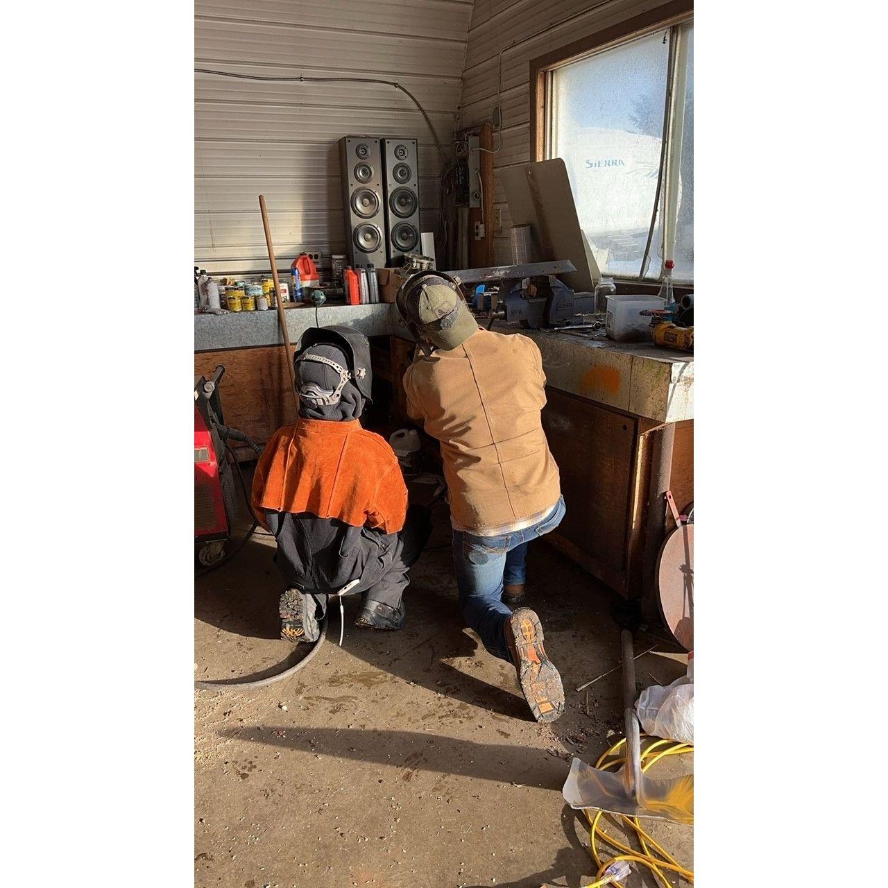 Brandon is an awesome teacher. Here he is taking Khristen's sister Karlie under his wing as she is a very talented welder.