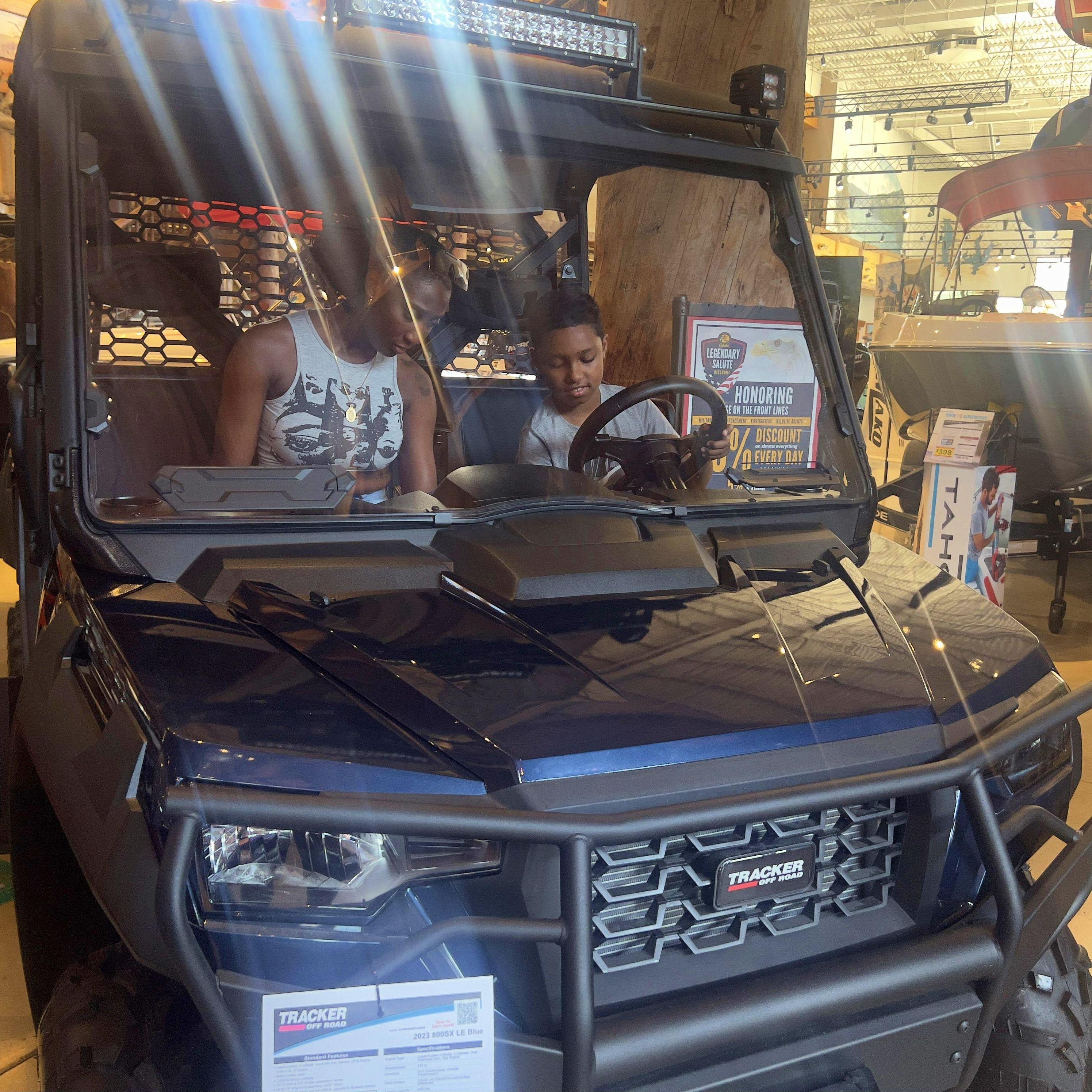 Hanging out with Elijah's little brother at Bass Pro Shop