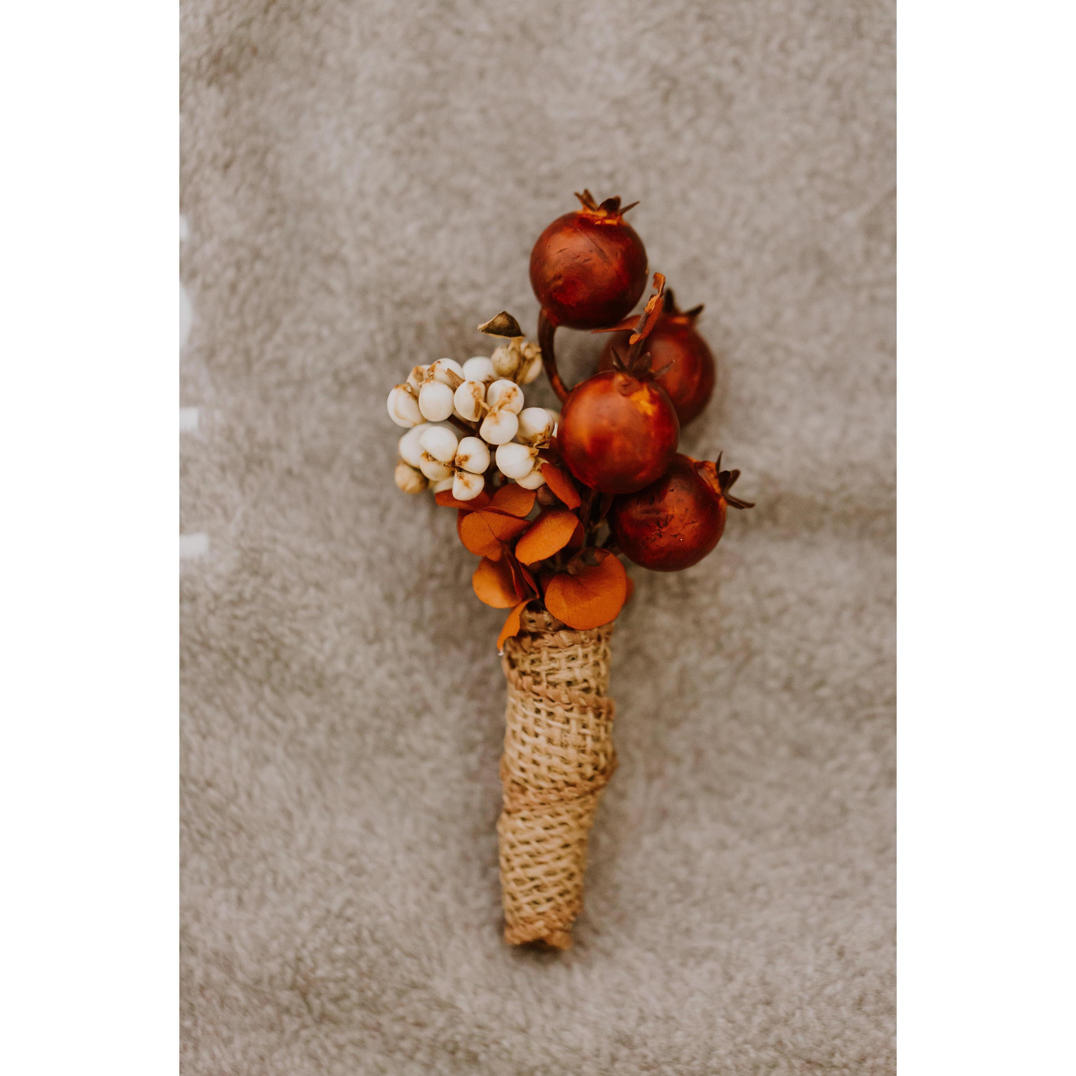 I made Andrew's boutonniere myself, so it would match my bouquet.