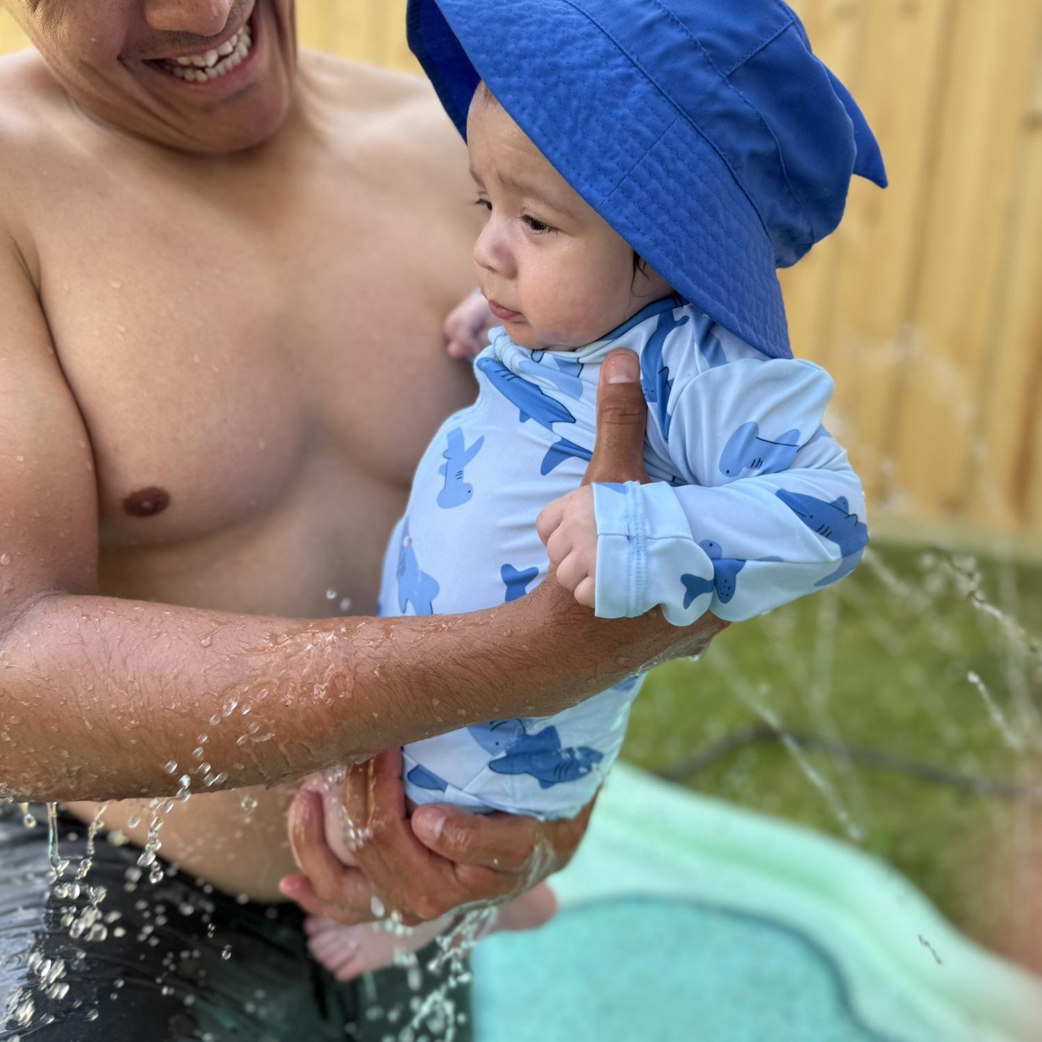Baby Jeffrey's first time on the splash pad.