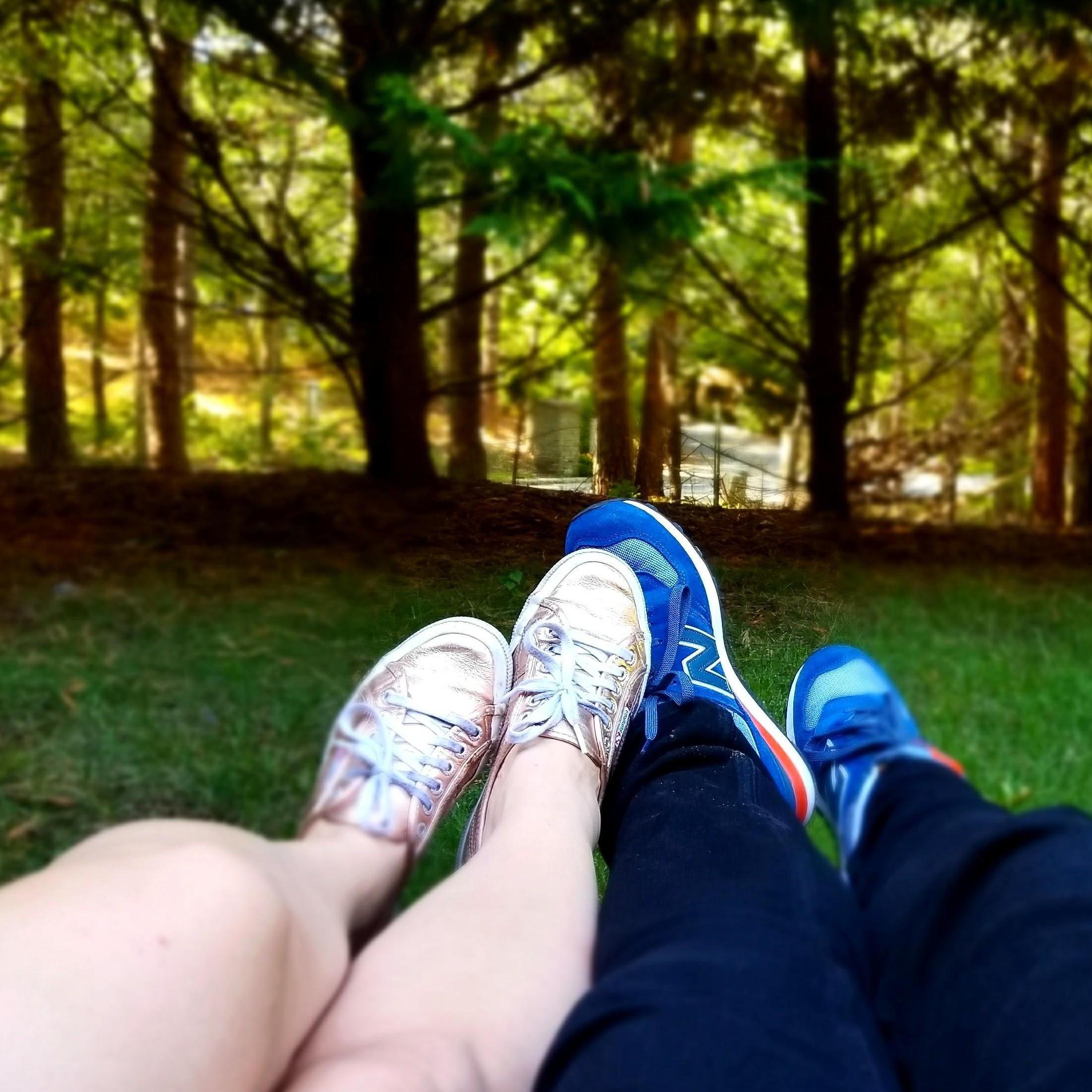 Two disembodied but very in love sets of legs, on a hammock in East Hampton, NY