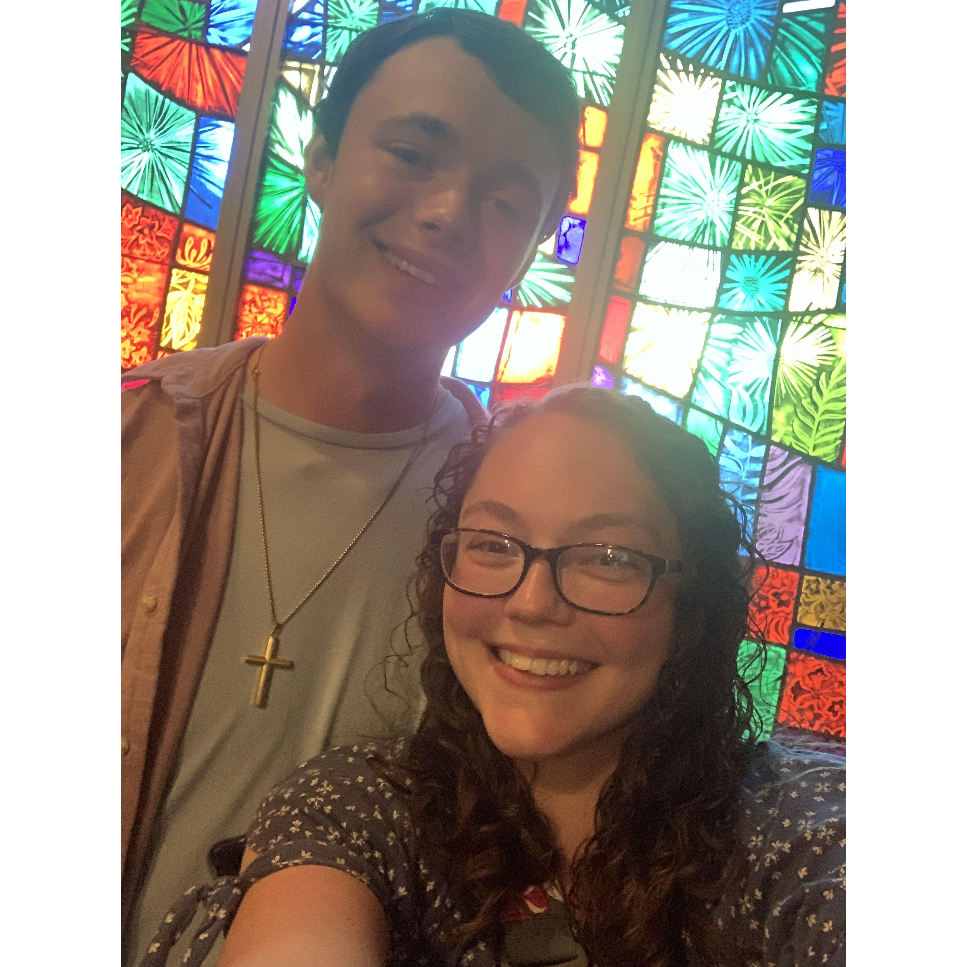 We took this photo right after Cody proposed, in a little chapel with a beautiful stained glass window, at Callaway Gardens.