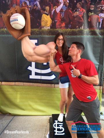 Syd showing off her muscles while cheering on the Cardinals!