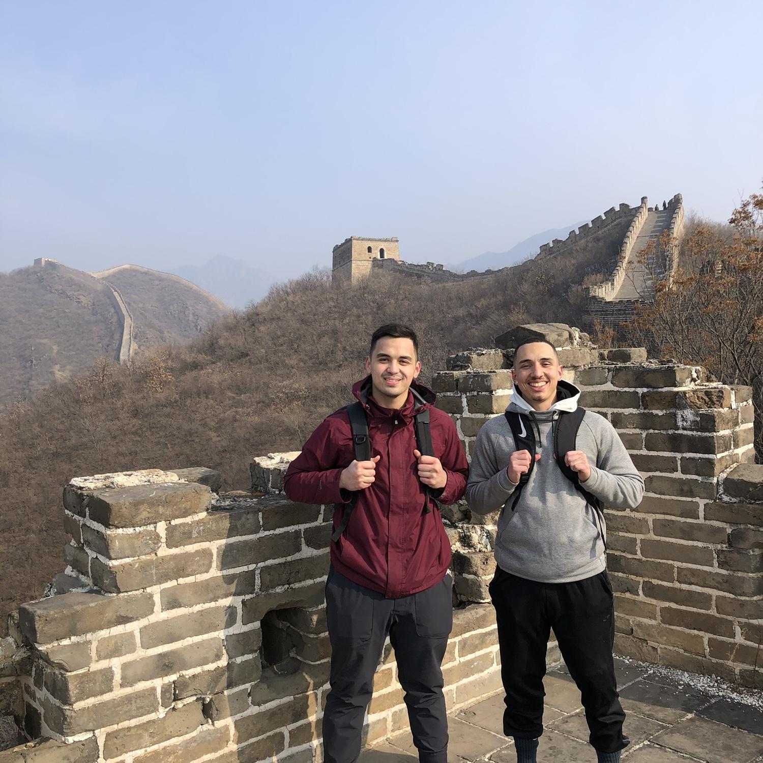 Cameron and his groomsman, Daniel, on top of the Great Wall of China when they lived there!