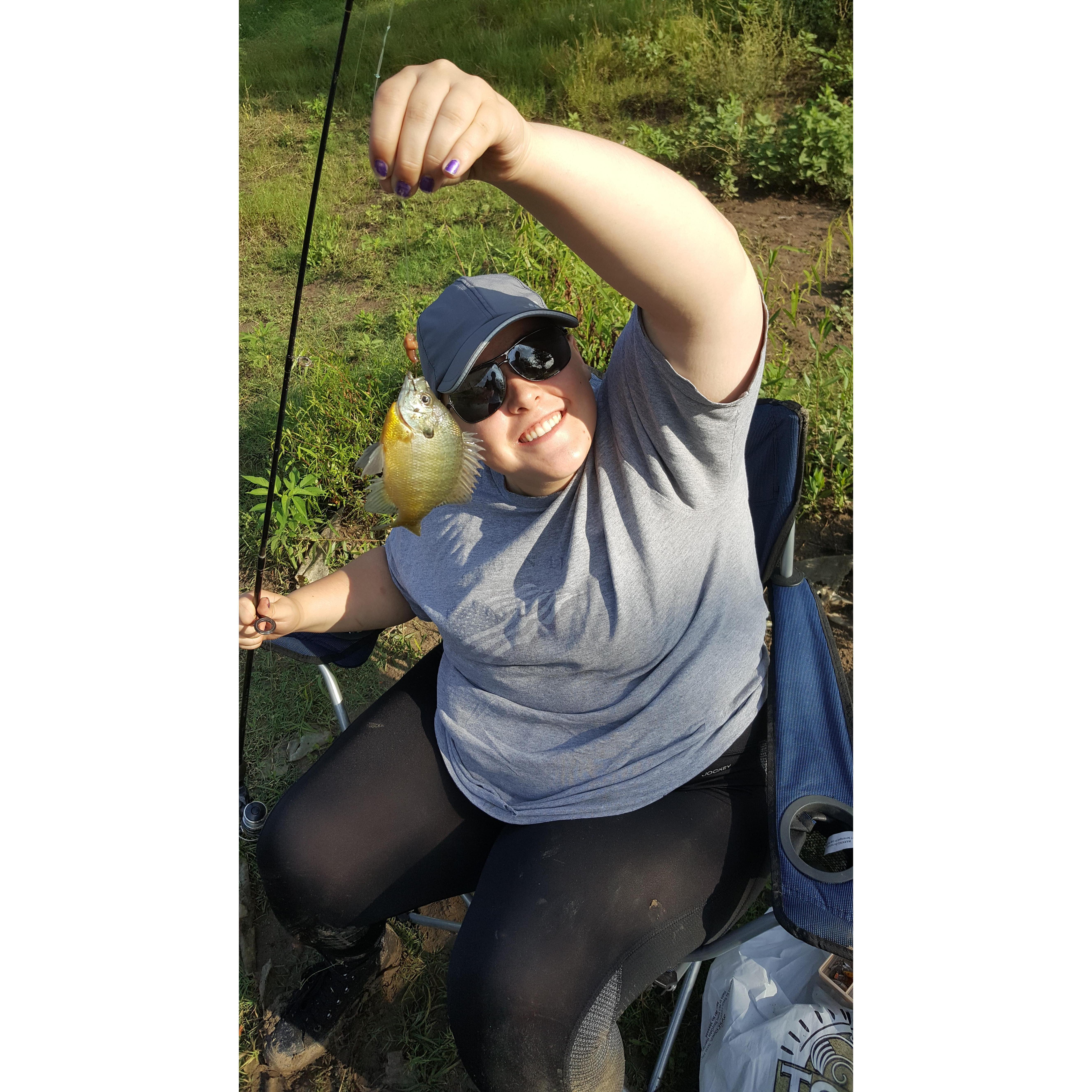 Serena caught a pan fish when she and William were fishing at Lake Ray Roberts.