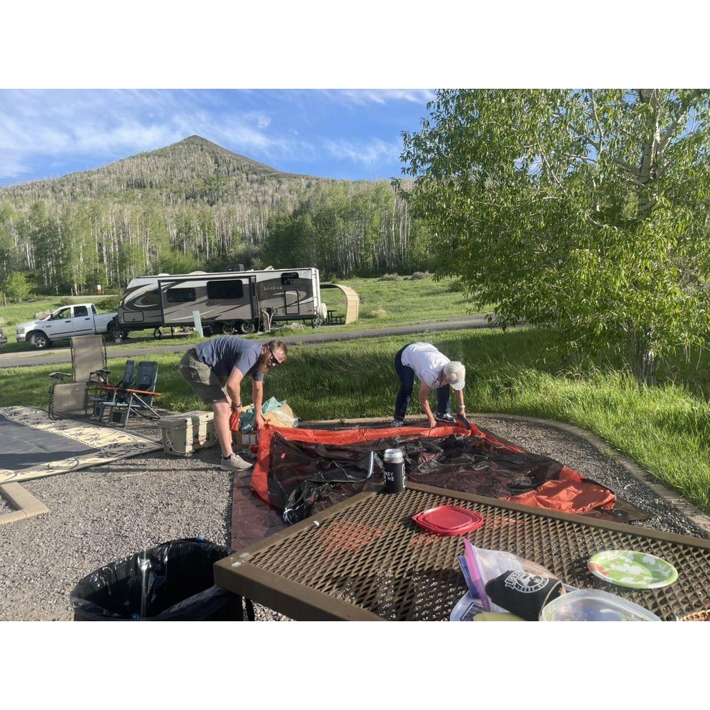 Ryan and his Grandma setting up a tent while camping at Vega State Park!