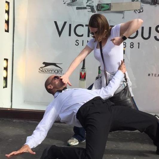 Sarah poses with a street performer; London 2017