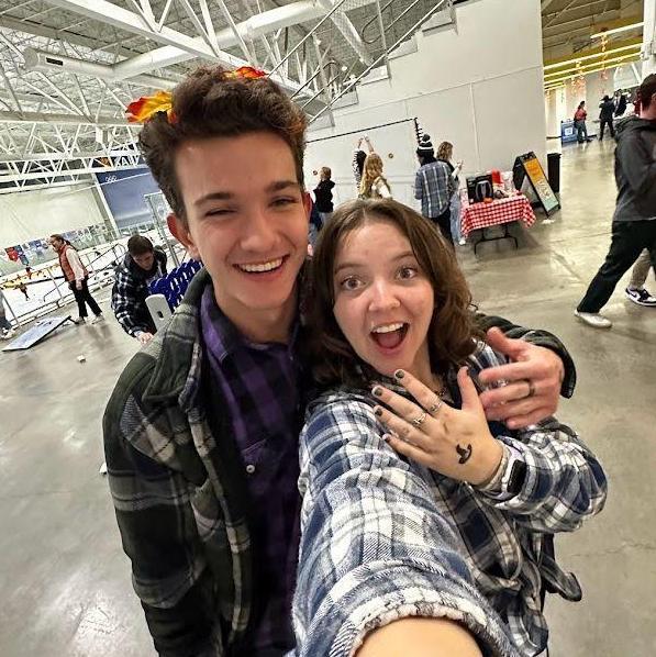 November 2023 showing off our fake hand tattoos! This looks like a ring pic lol