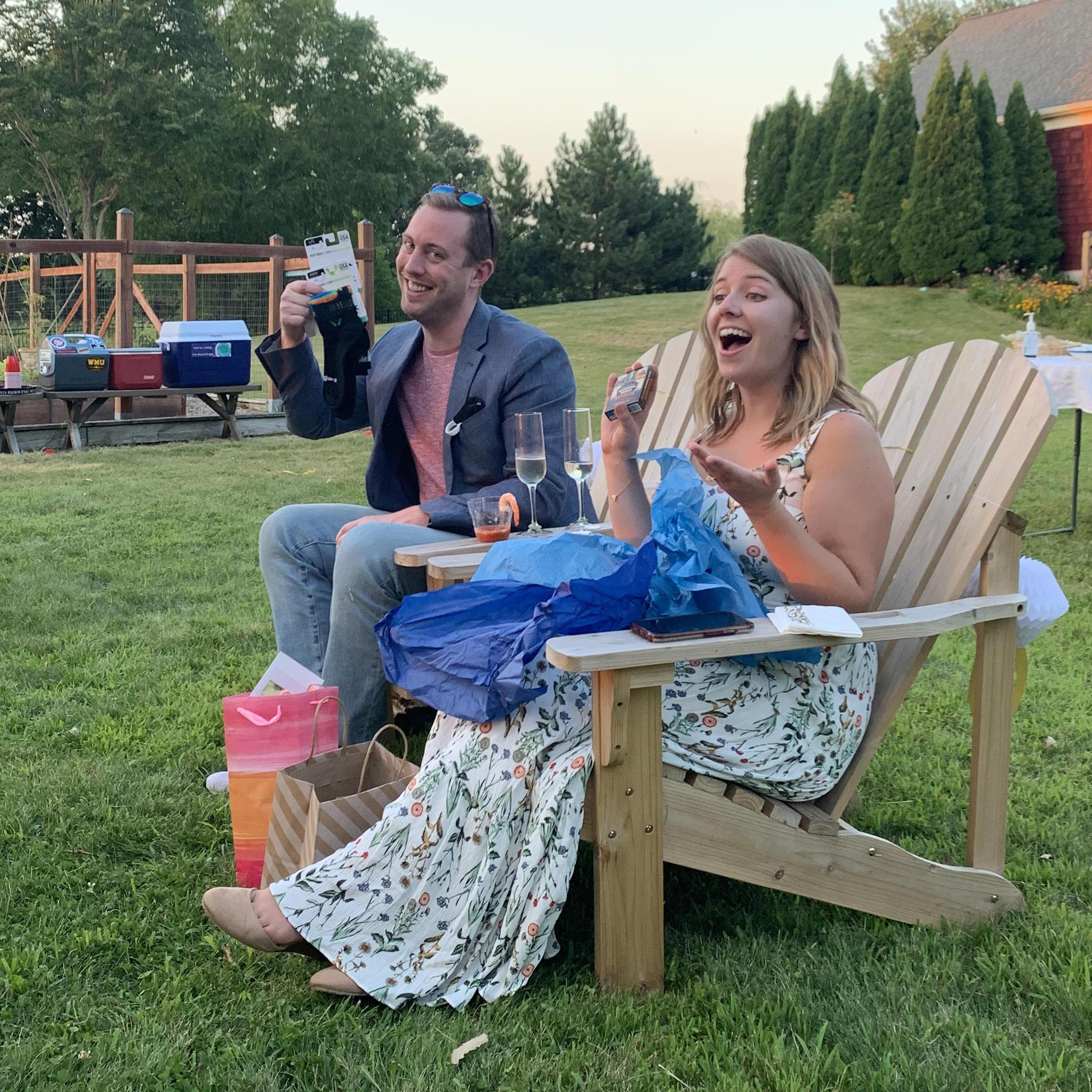 Us receiving matching Yellowstone socks from Chelsea and Tim to celebrate our engagement (while maintaining 6' of outdoor separation between households)