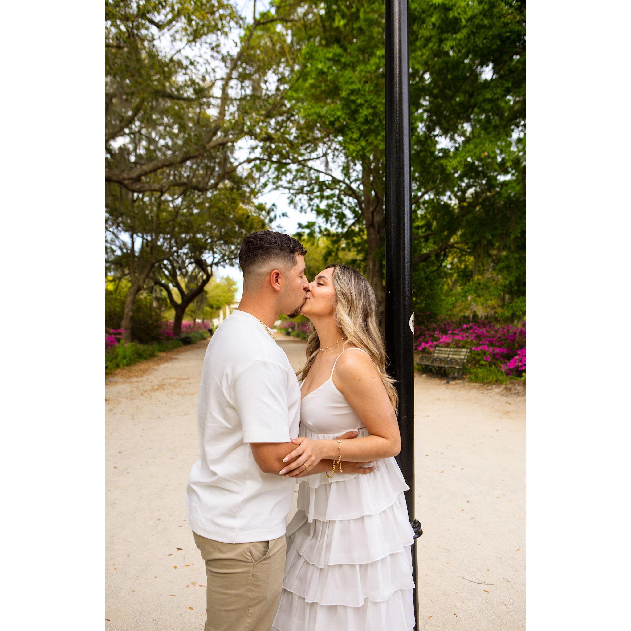 In this picture, Gabe was setting up everything from the proposal so he just said "let's take a picture with this post" while waiting for Luiza and Josh to set up. Mariana had no idea!