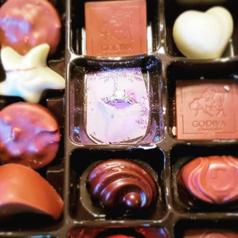 Close up of the ring in the box of chocolates