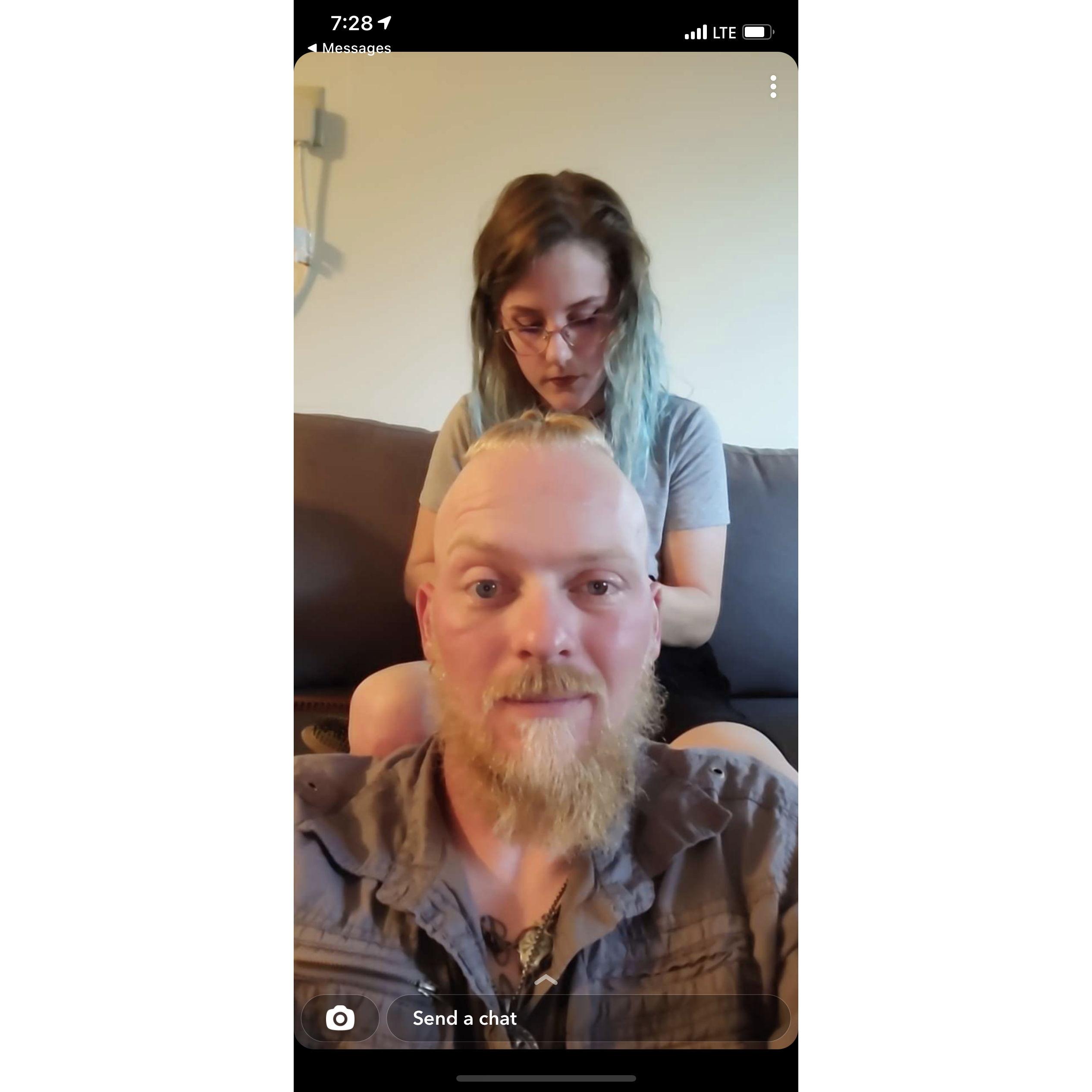 Learning to braid his hair.