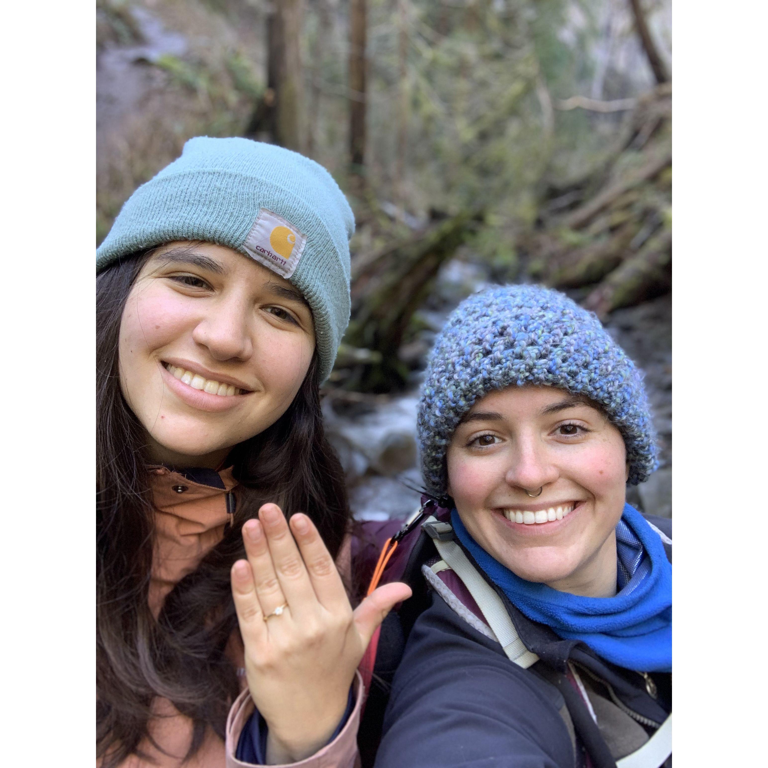 Alex proposing to Micaela on a hike in Oregon.