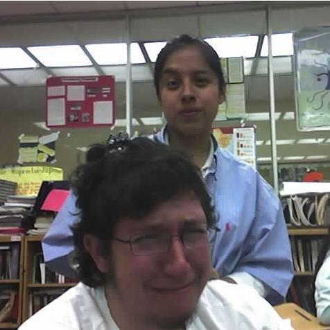 Fixing Jonathan's hair during class. circa 10th grade?