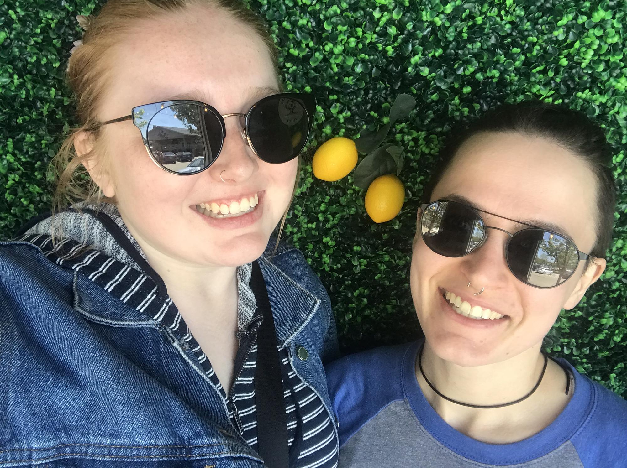 In front of a very verdant wall at a juice bar in Saugatuck!