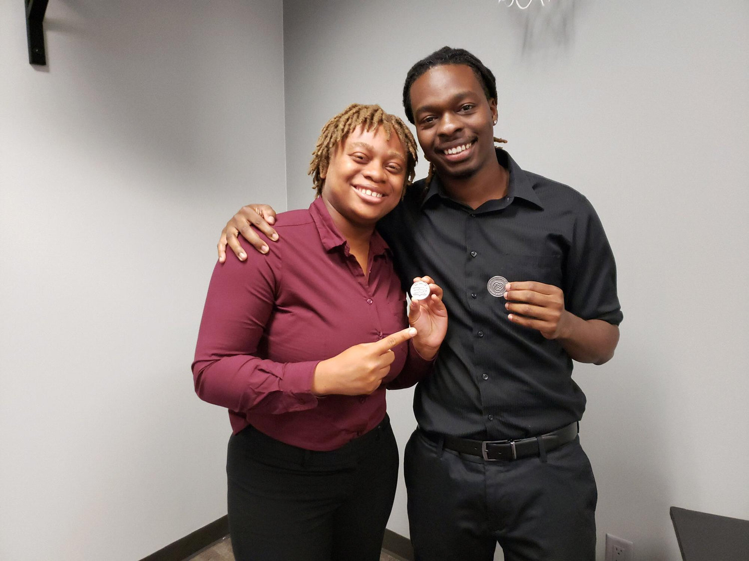 Kyla and Jordan awarded with Maximum Impact coins from their company
