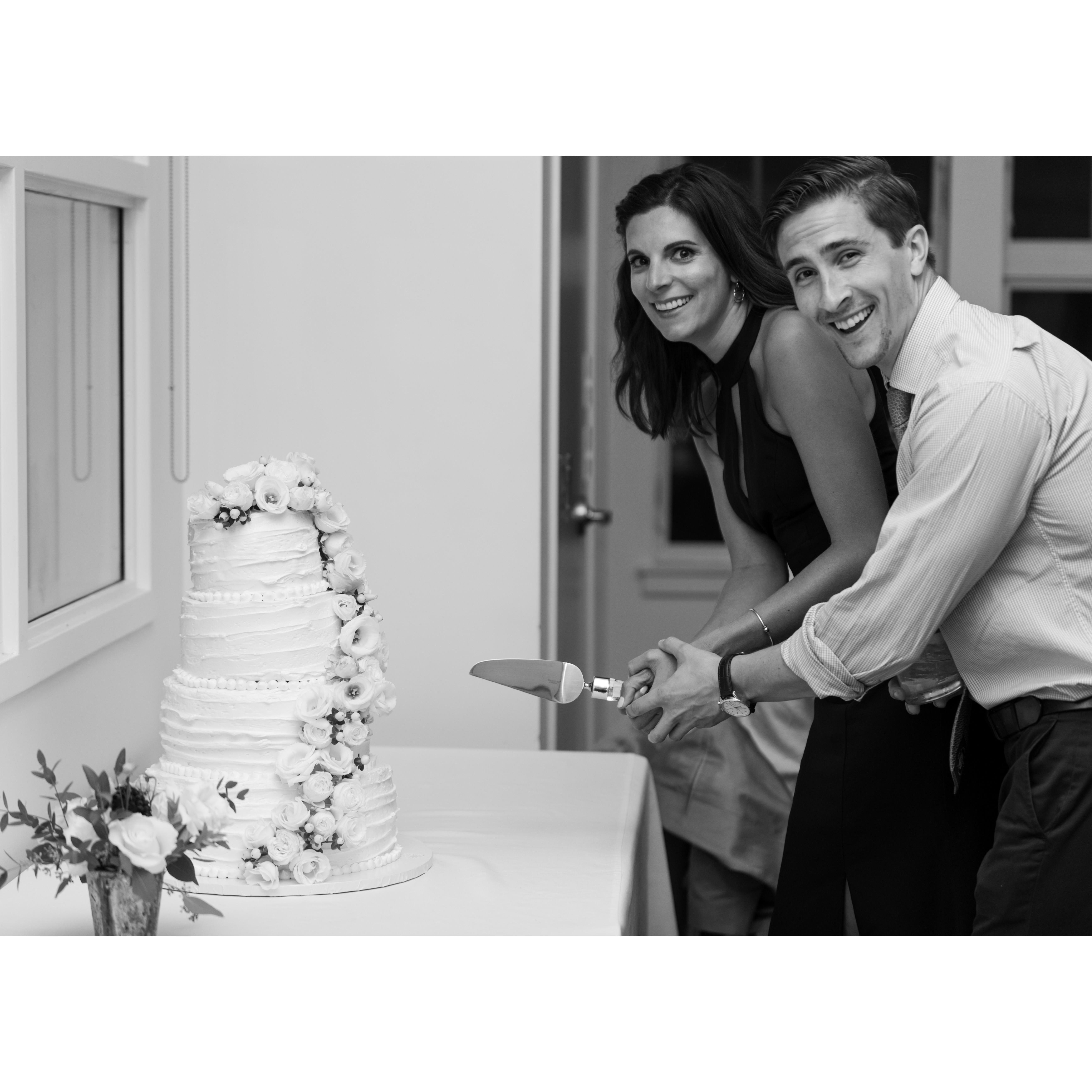 Pretending to cut the cake at Caroline's sister's wedding.