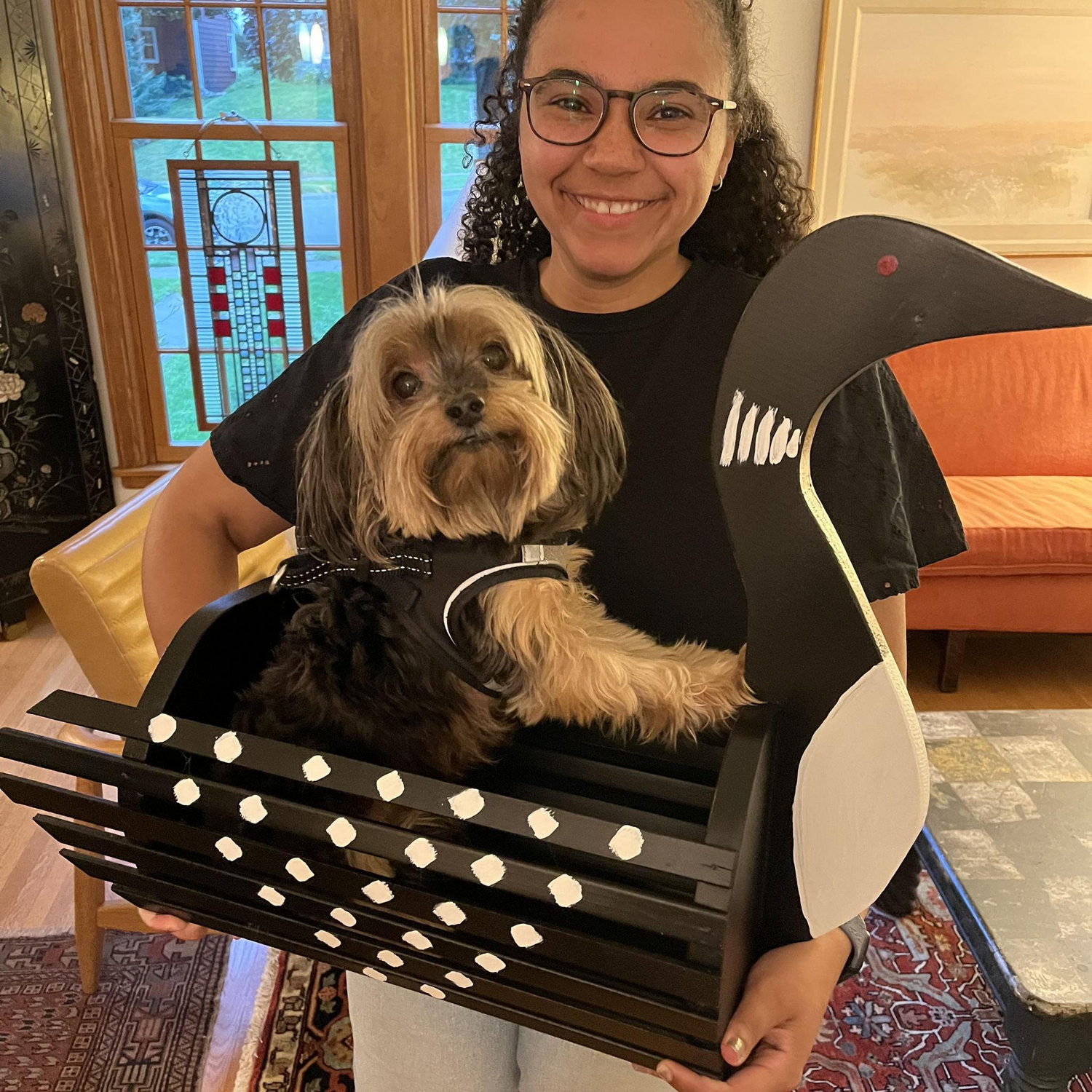 Maya with our dog, Riley, in our loon planter made by Colin's dad, Doug!