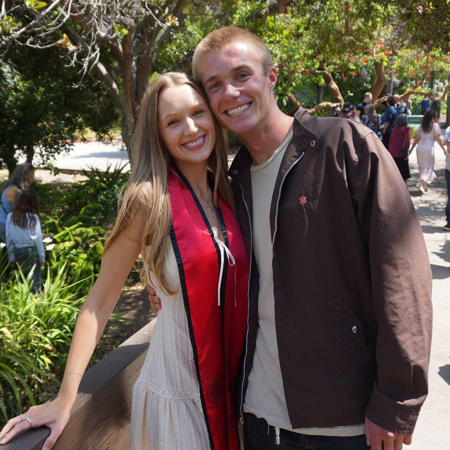 The couple posing at Molly's college graduation.