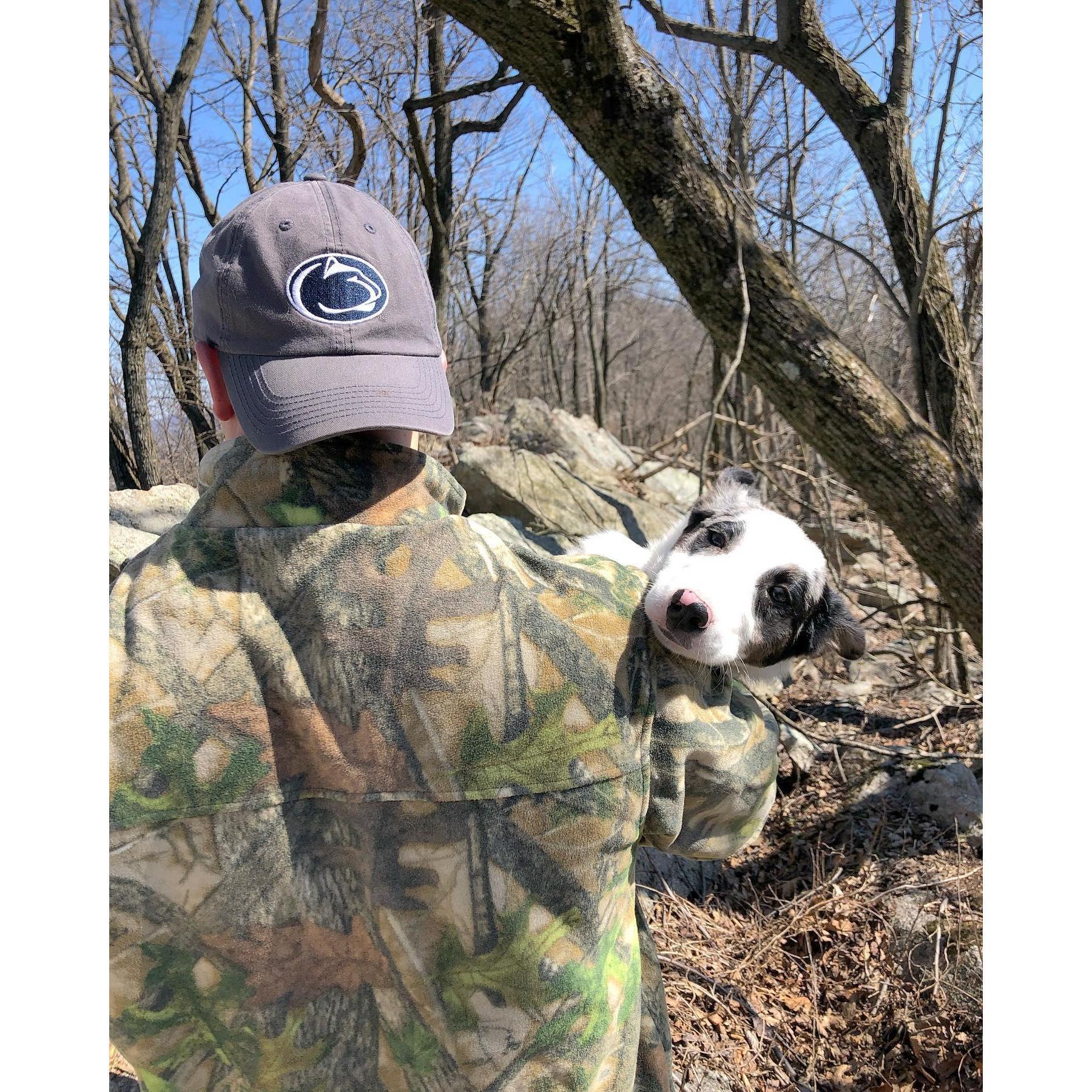 Anthony carrying our sleepy pup