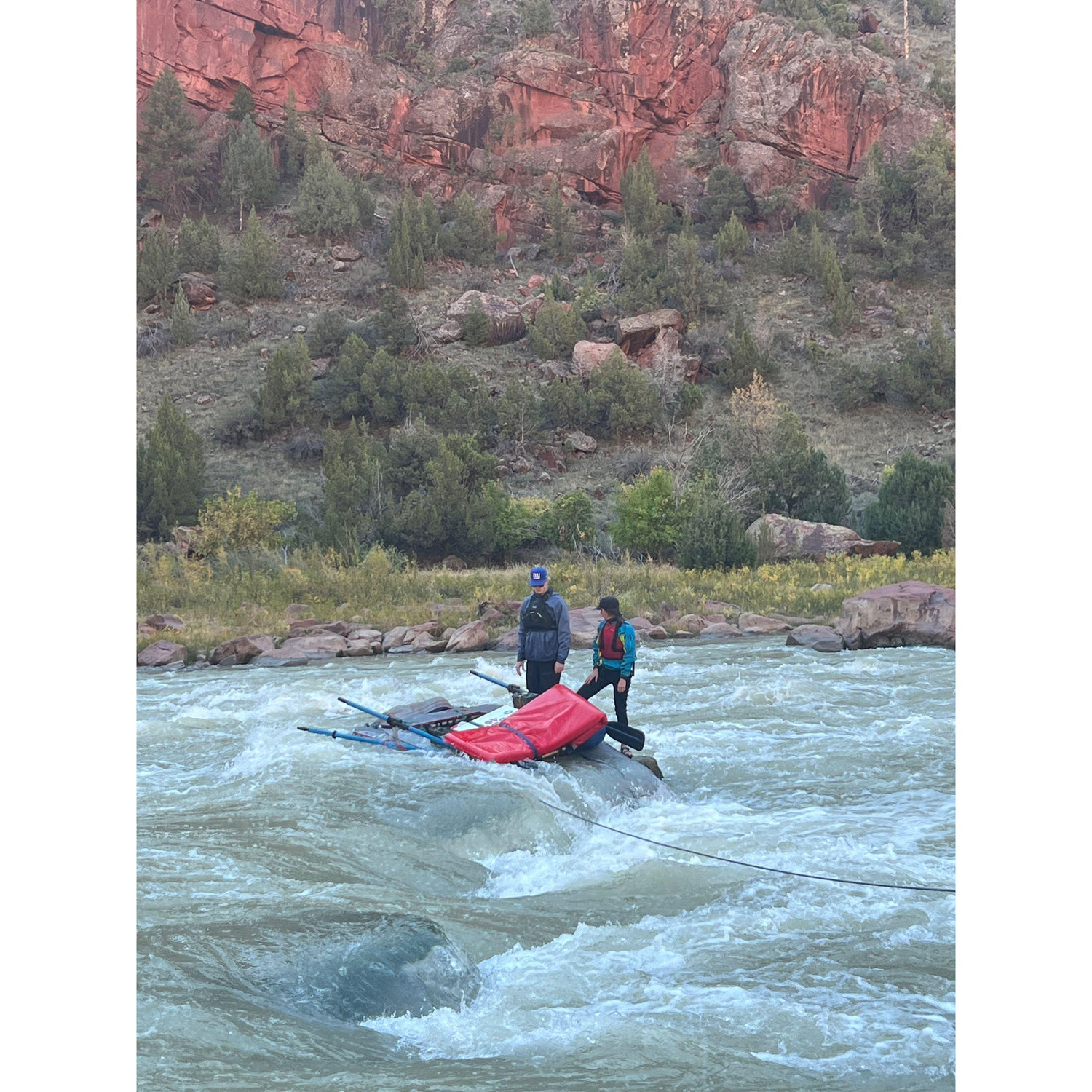 Stuck between a rock and a hard place in Hell's Half Mile on the Green River.