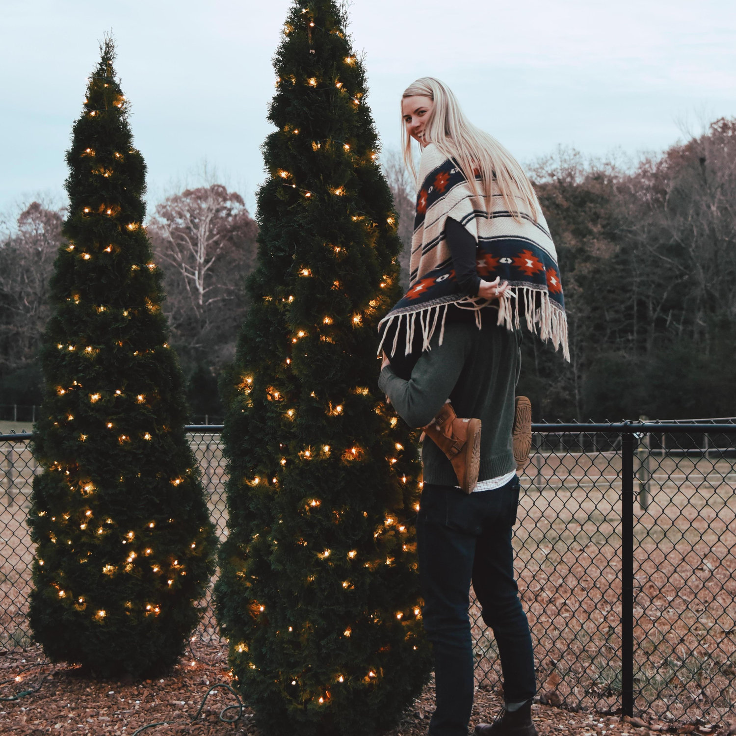 Decorating a tree is tough, unless your fiance doubles as a ladder!