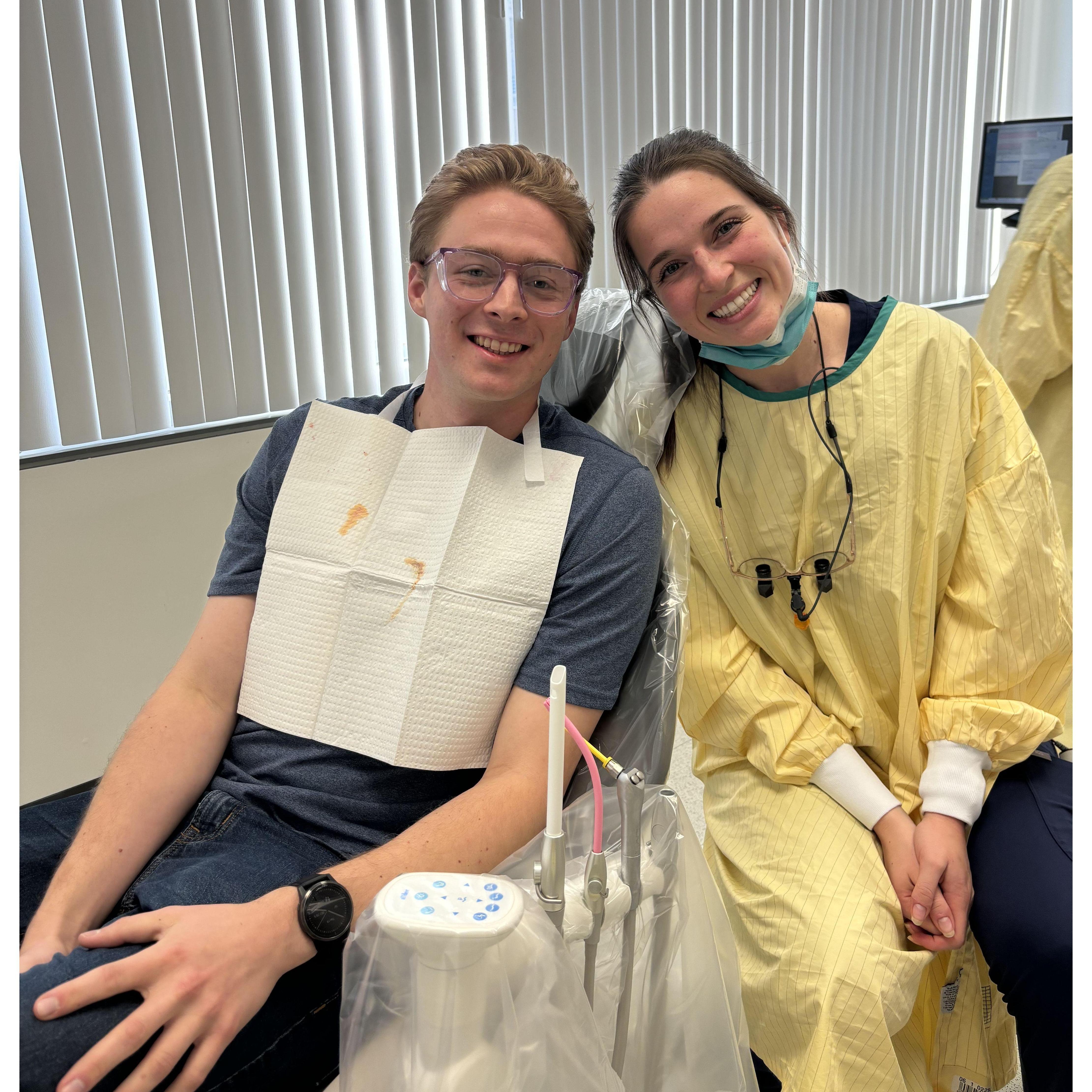 As Caroline transitioned into full time patient care, the school gave students the opportunity to bring in friends-- so Stephen had the honor of being her very first patient!