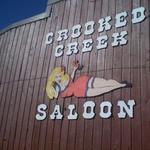 Grab a beer by the fire at Crooked Creek Saloon