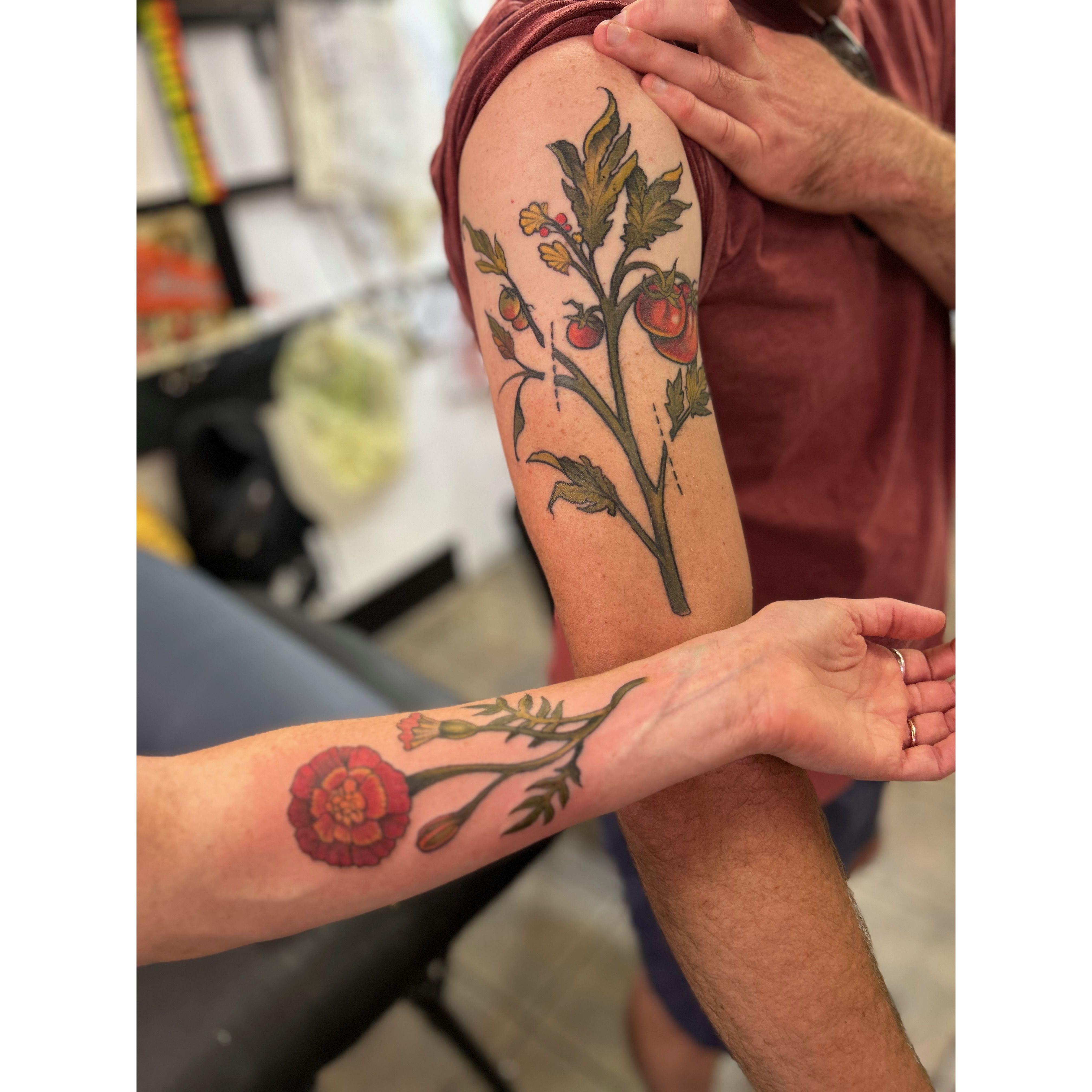 "Companion plant" tattoos. Marigolds and tomatoes love to be planted together :)