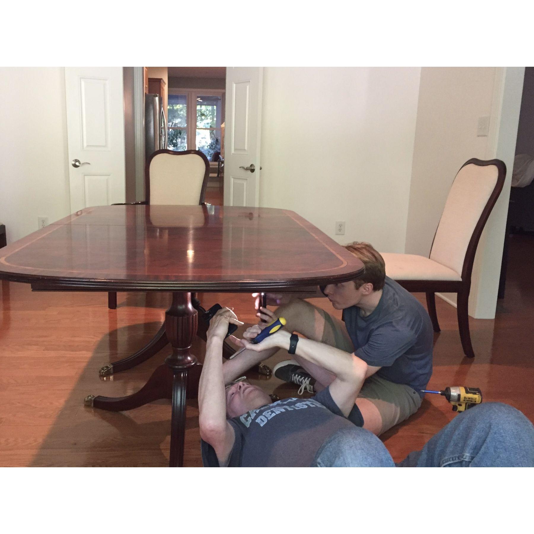 A typical Sturdevant scene - Adam and his dad working on putting our table together.  We love that it is a used and already has a few scratches (so we don't worry about making the first one!) -Aug 26
