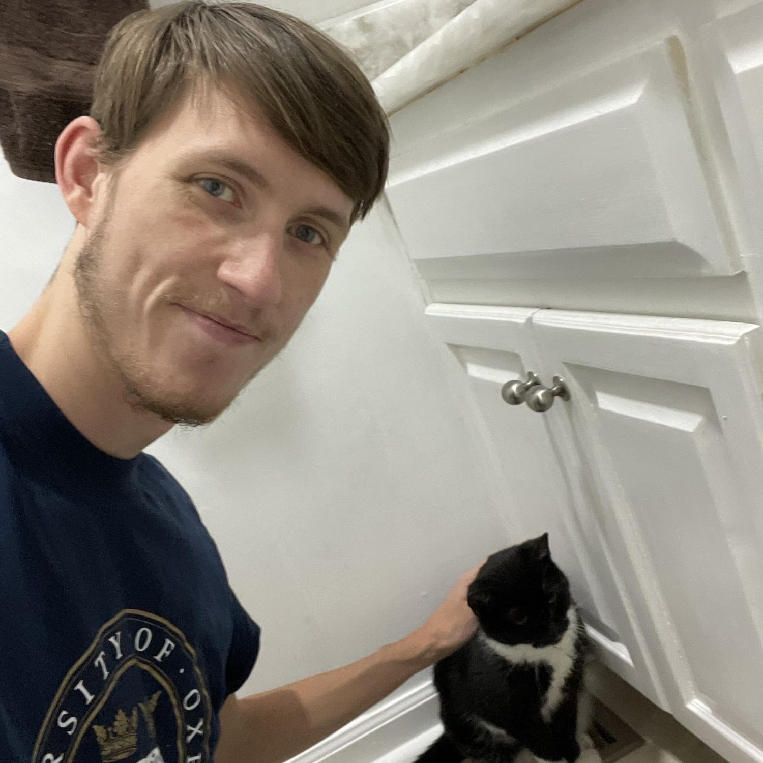 Benjamin is a cat lover too, his grandparents have three cats, Witty, Gracie and Bean, he adopted one at Mississippi where he attended the college, the orange tabby he had named Peanut.