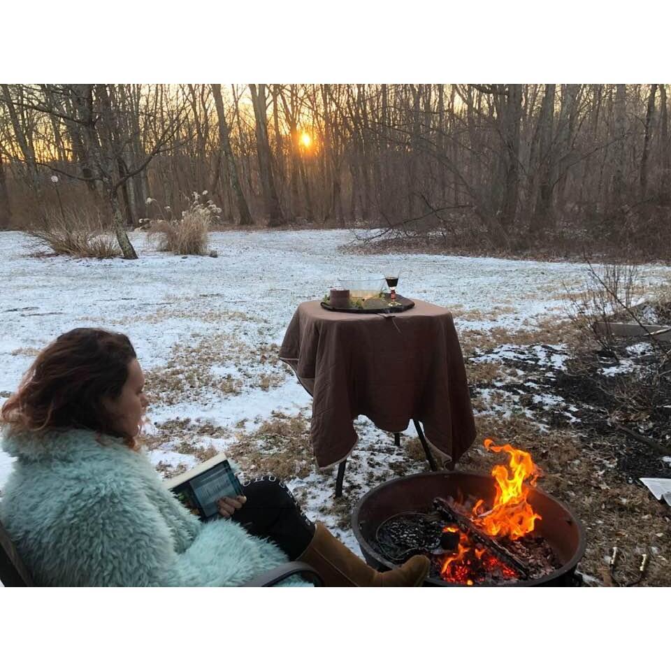 He caught me reading by the fire.