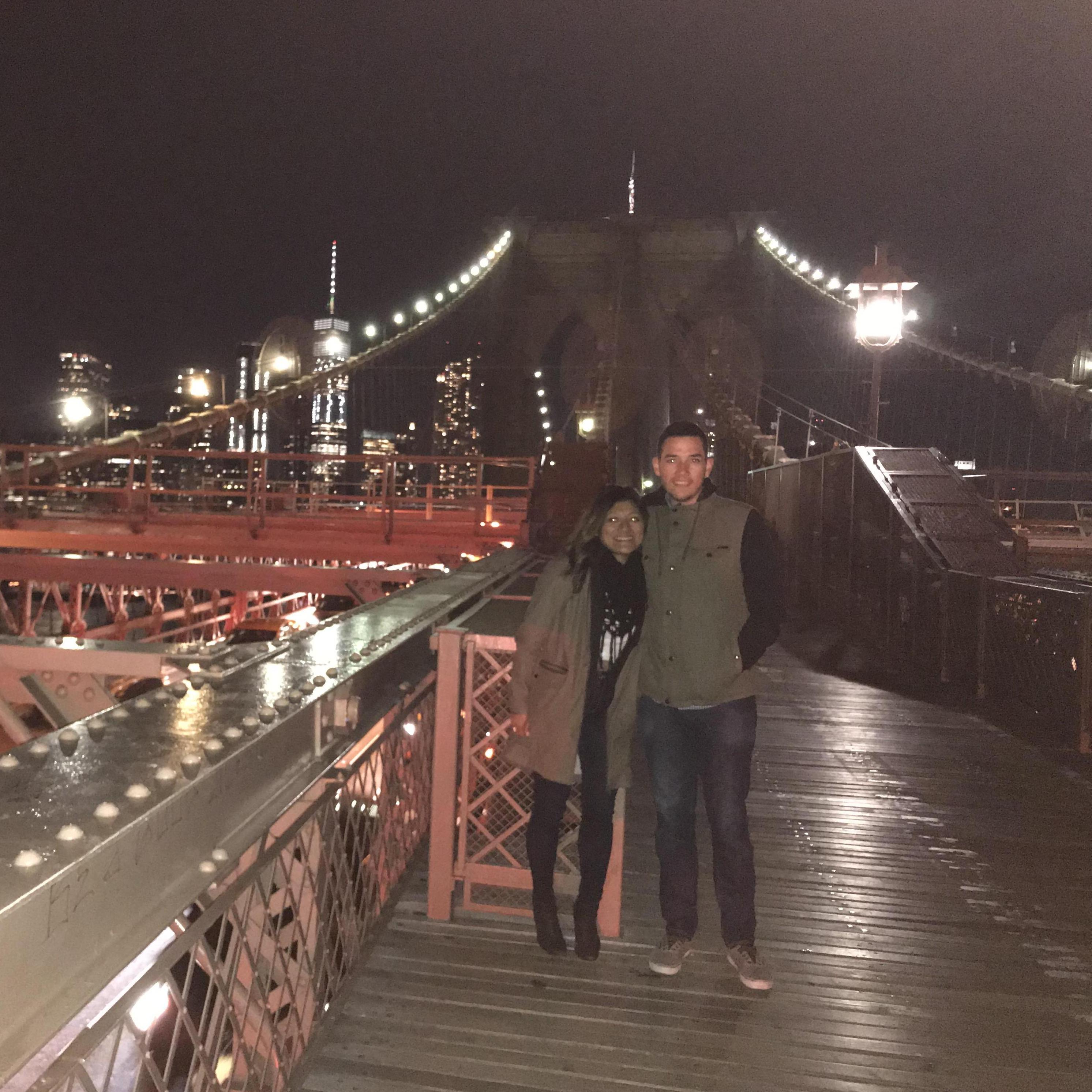 On the Brooklyn Bridge, seconds before Michael popped the question. A stranger took this photo.