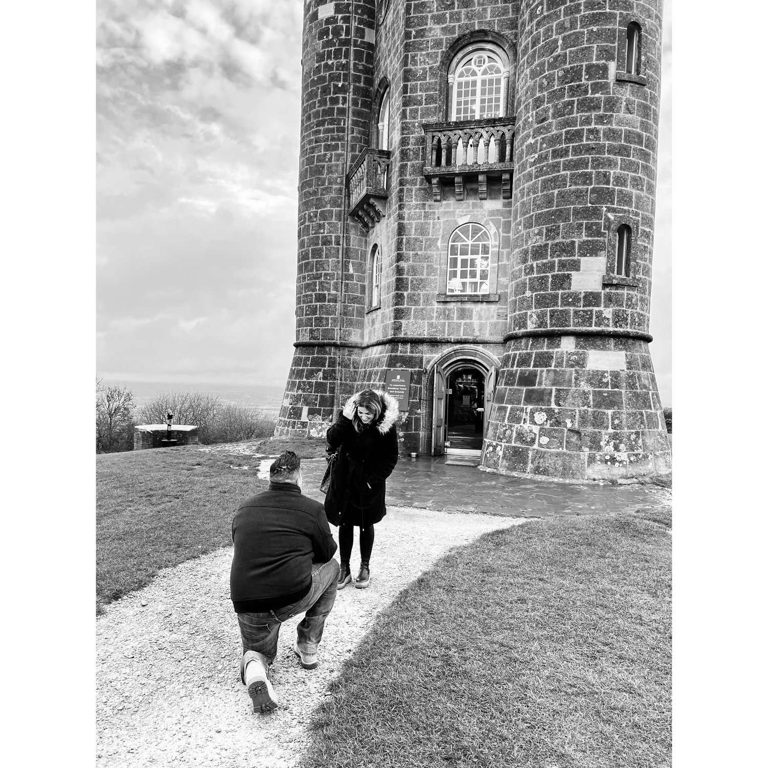 The moment he asked me to be his wife... followed by the easiest "yes" of my life. (Broadway Tower in Cotswolds, Engand)