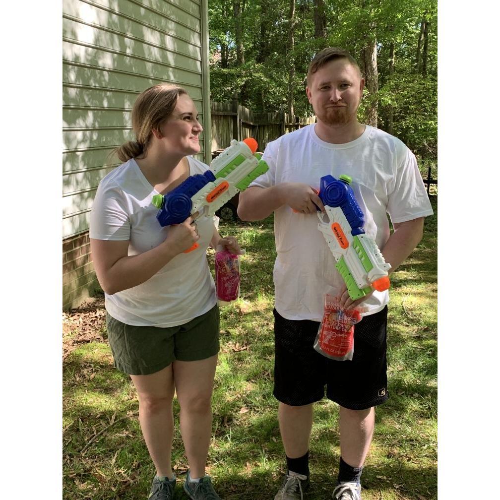 Backyard colored water paint battle