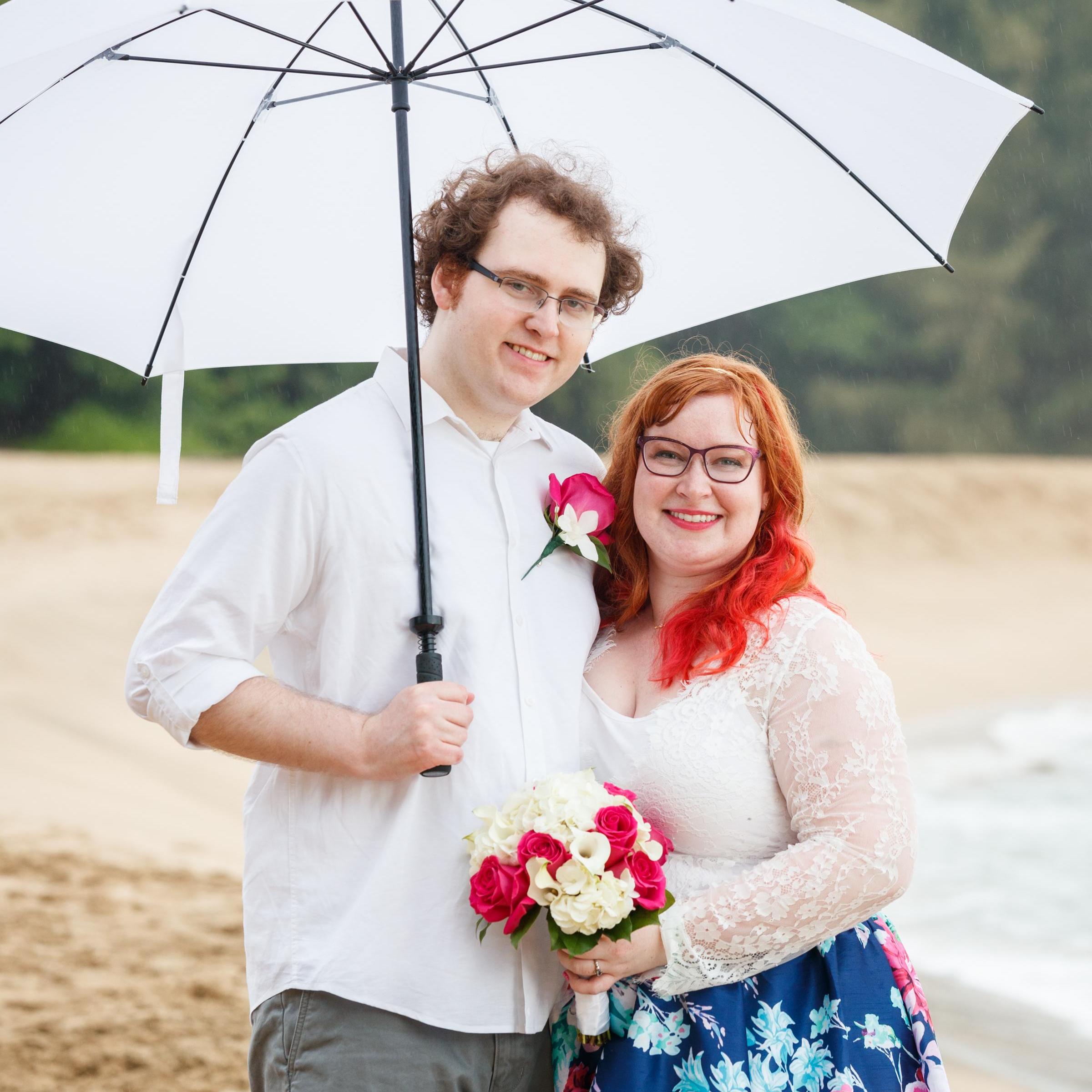 Did I mention that it rained while we were doing pictures? Thank goodness our planner and photographer brought loads of umbrellas.