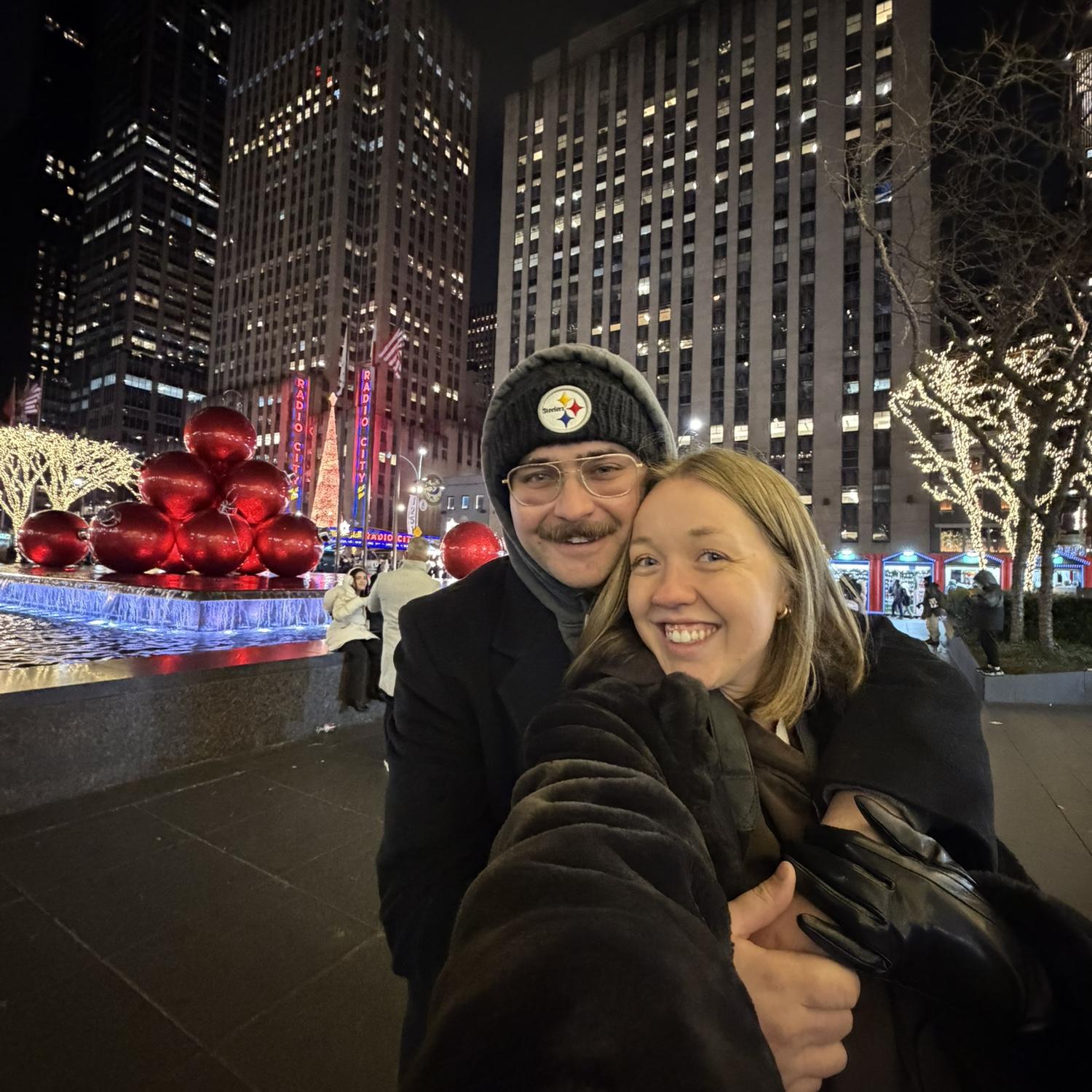 Maria, clueless that Will was going to propose in 10 minutes. They were looking at Christmas lights and she was taking reference photos. At this point she convinced herself he wasn’t going to propose.