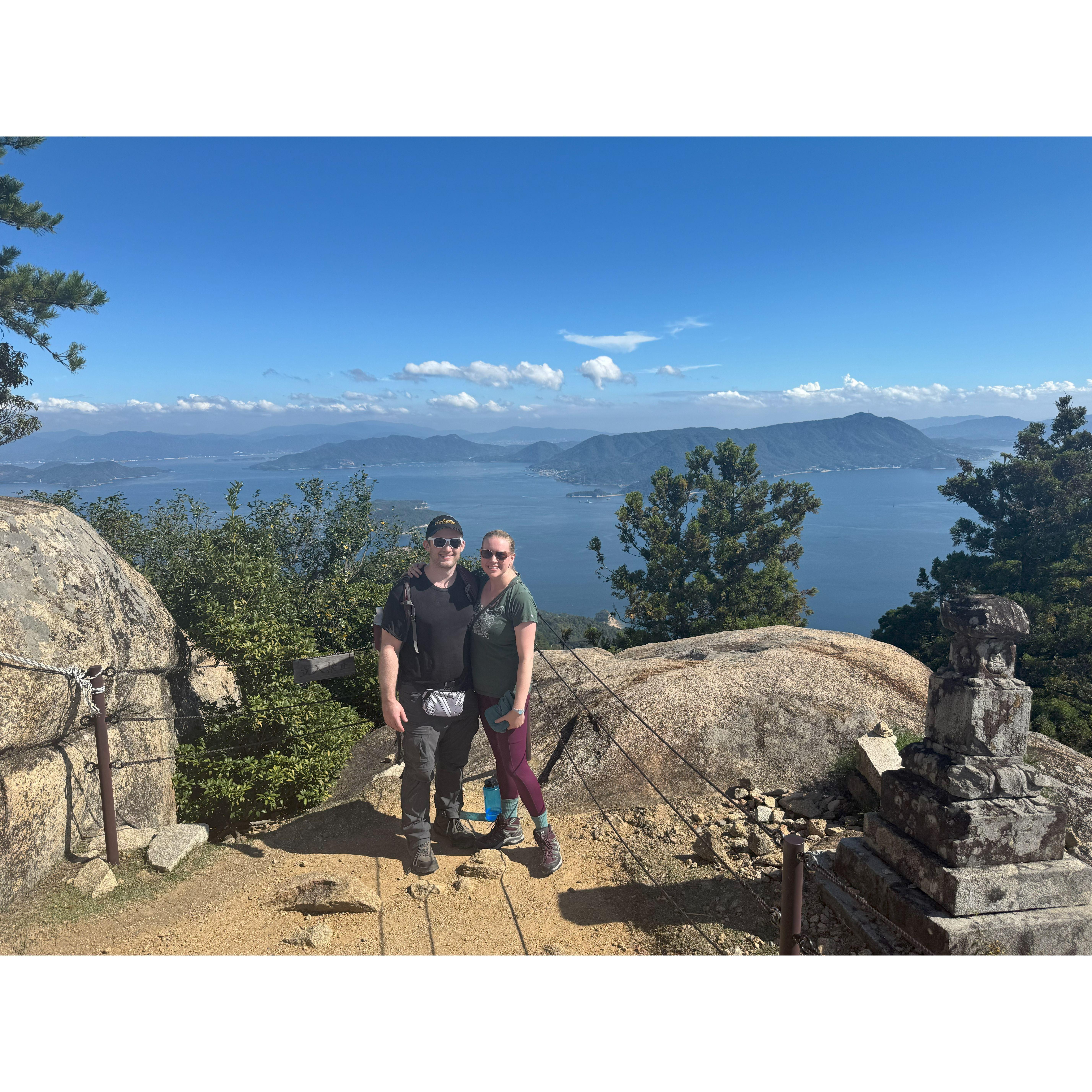 Taking a moment beside Hiroshima Bay in Miyajima