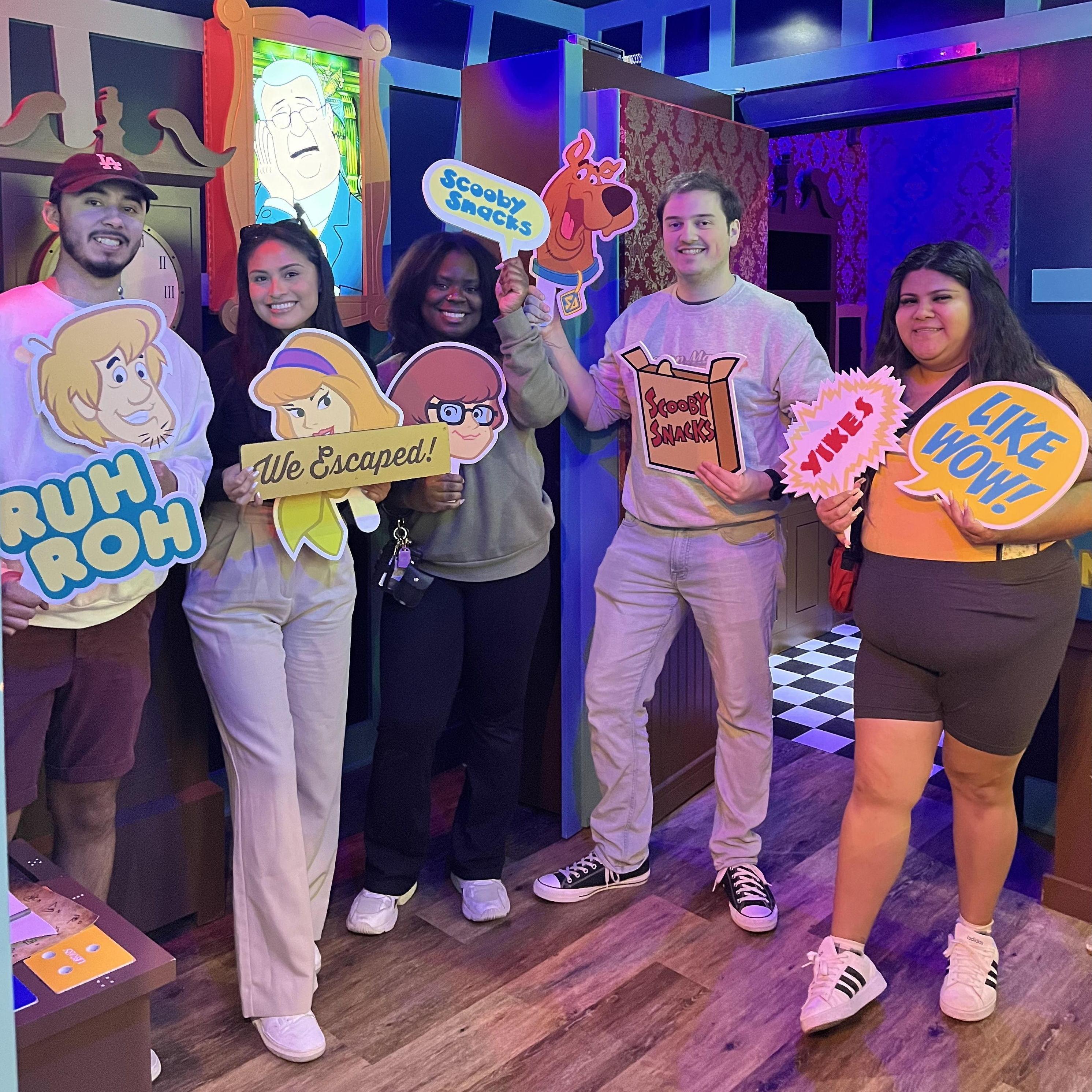 Javia and Taylor carry her childhood friends in a Scooby-Doo-themed escape room
