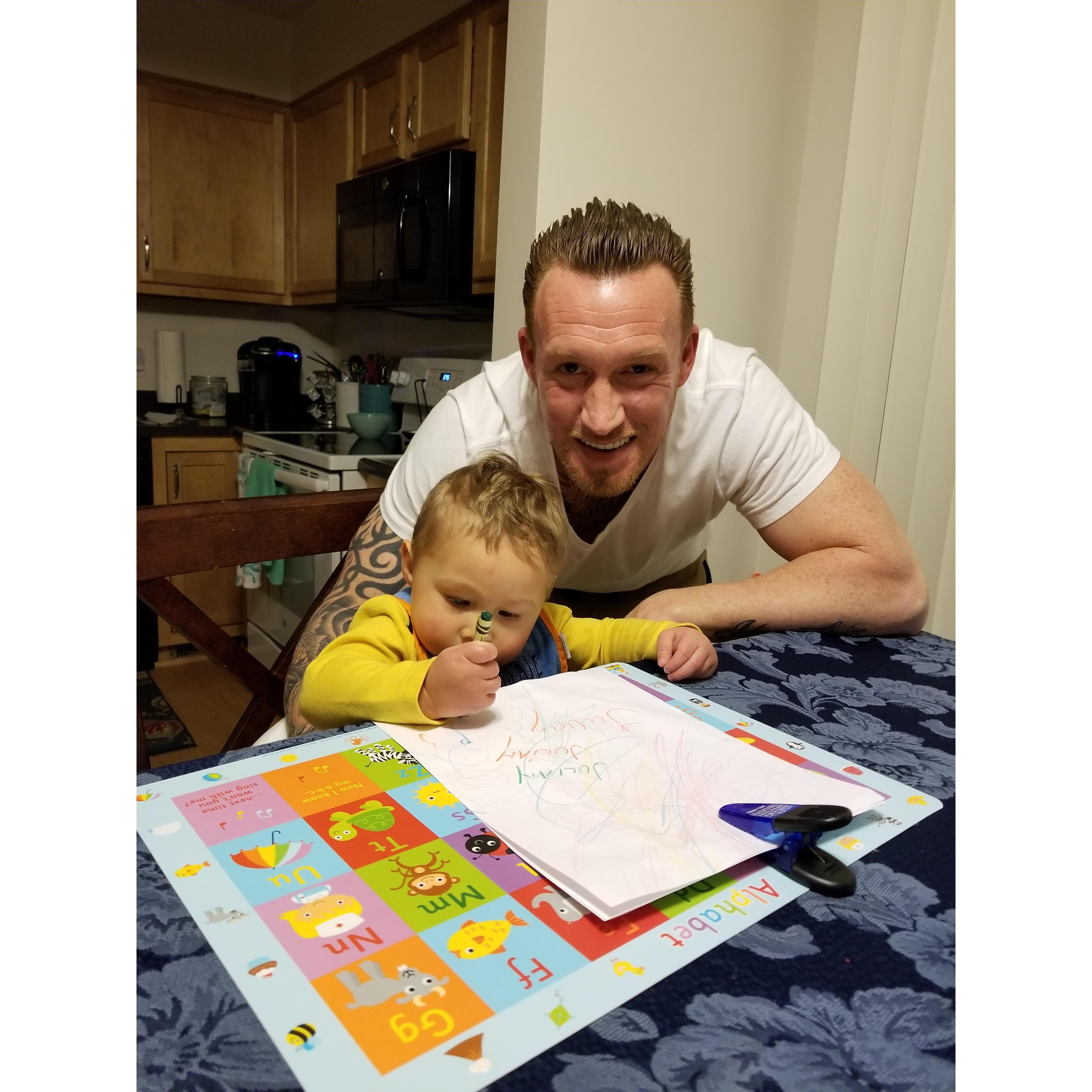 Working on his penmanship.