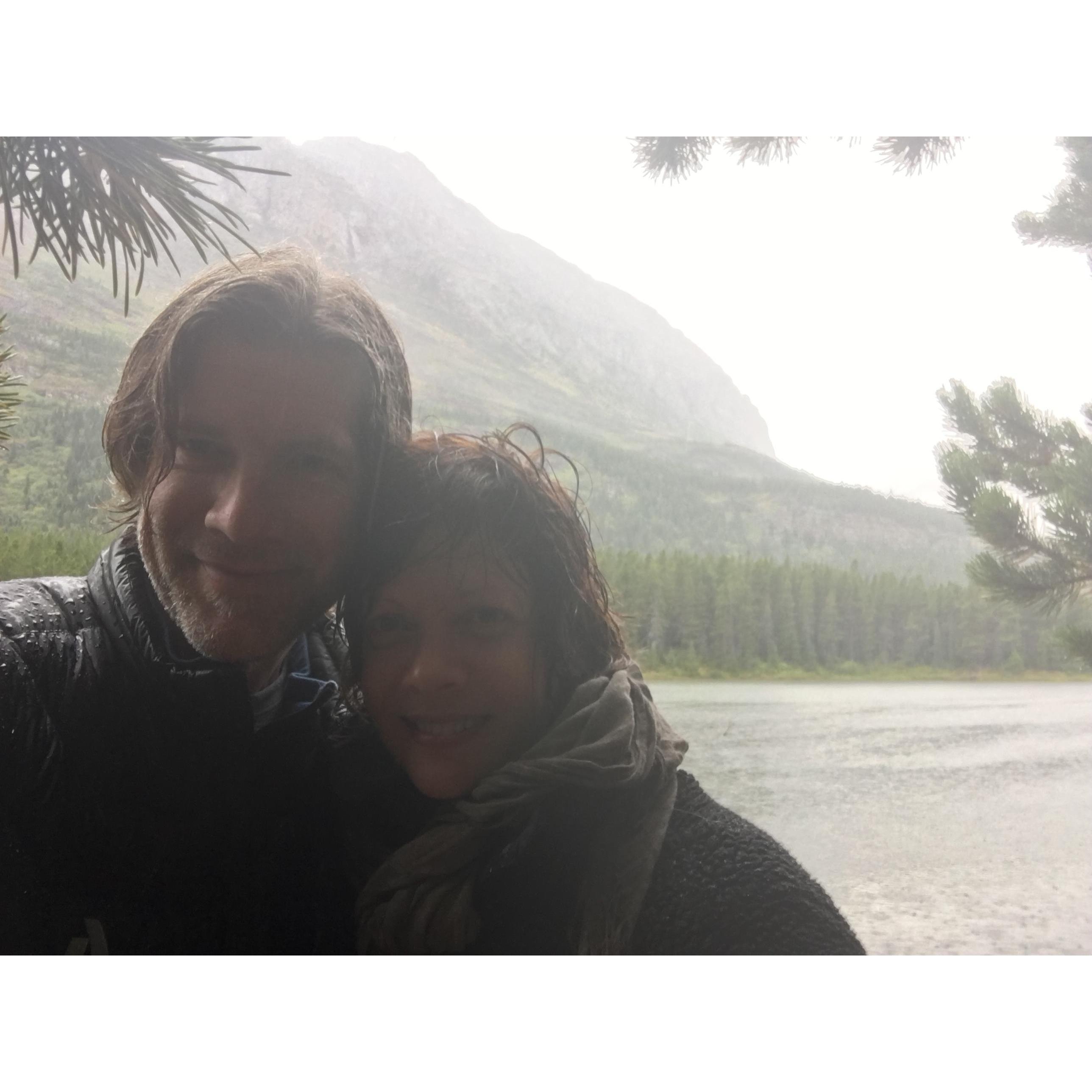 Caught in the rain in Glacier Park, with moose behind us!