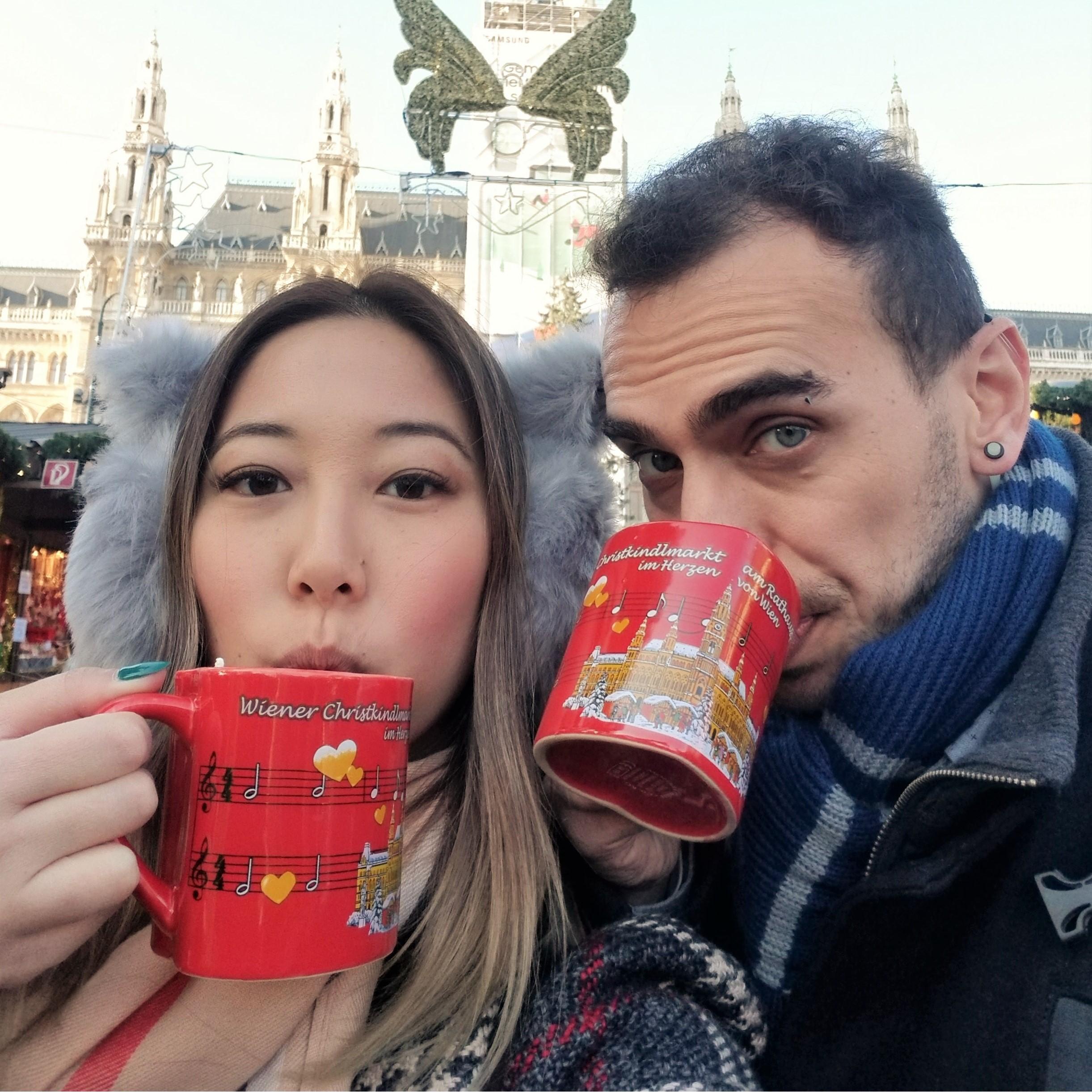 Partaking in one of our new favorite traditions, hot mulled wine at a Christmas Market in Vienna, Austria!