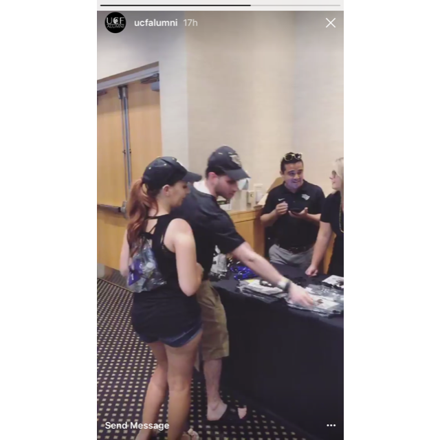 Josh taking free stuff on the UCF Alumni story 9/18/16