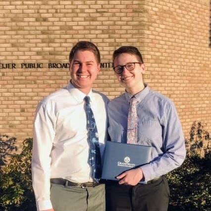 Theo getting an excellence award from their college program in 2019