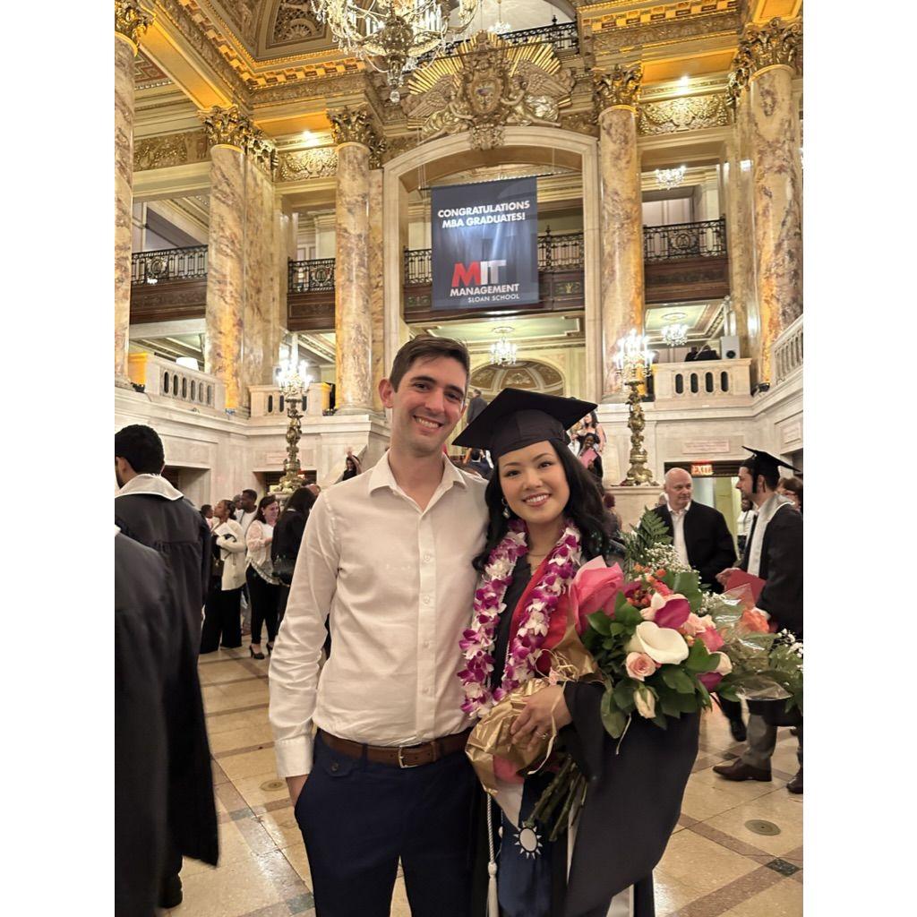 Nick returned the favor years later at Ping's MBA graduation in 2024. She's not so subtly hiding the fact that she'd been crying seconds before this photo was taken.