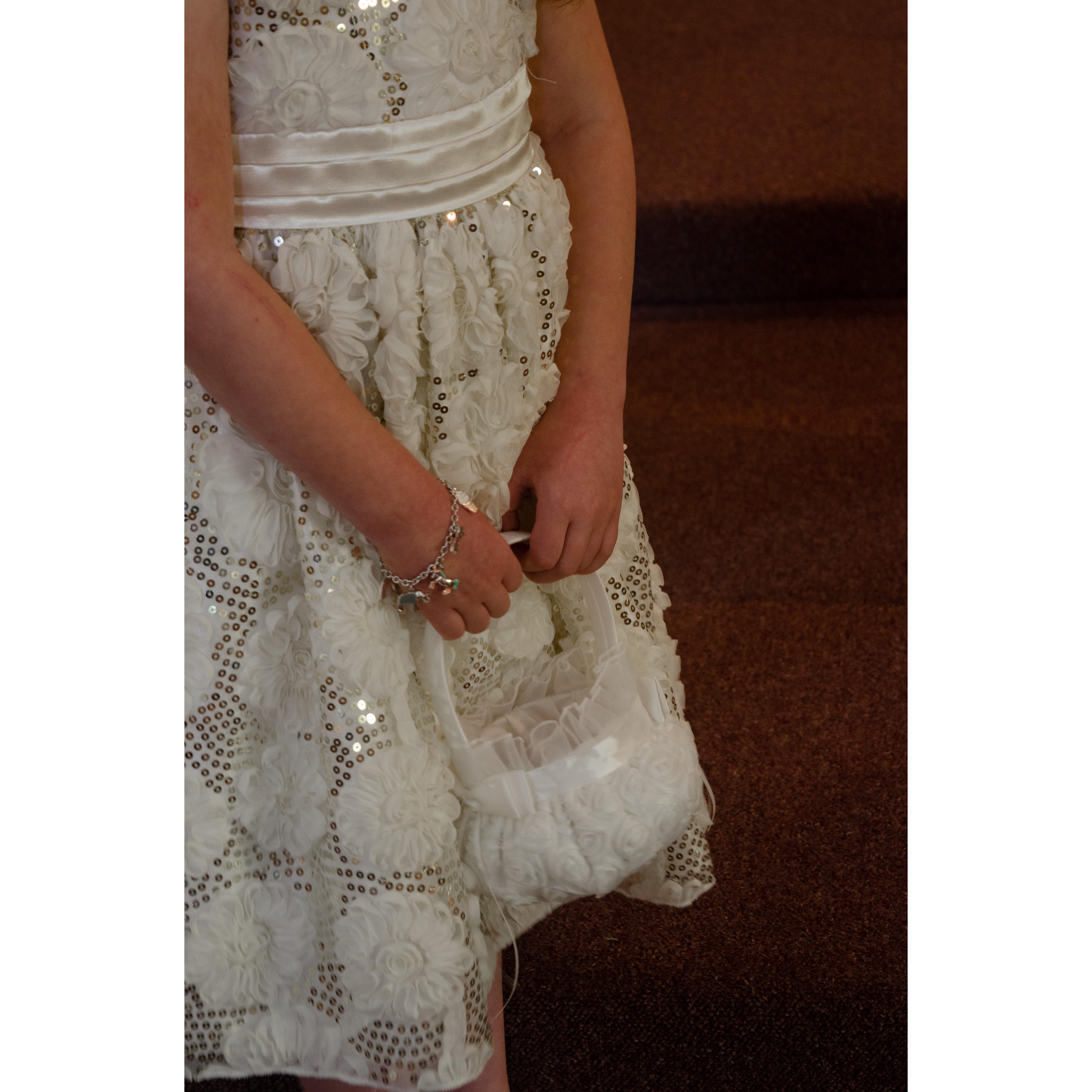 A close up of Lizzy's dress and the flower basket.