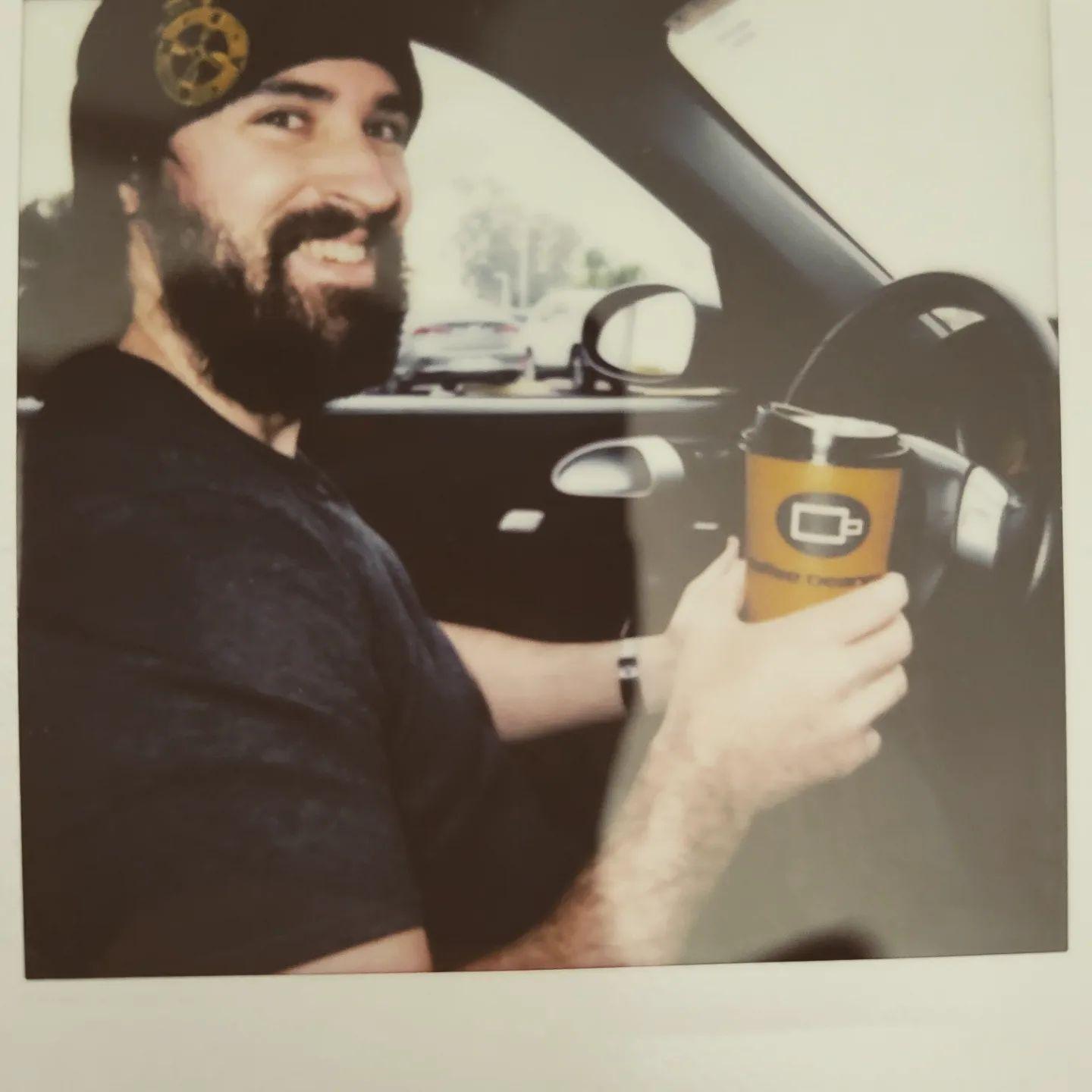 One of my favorite pictures of Matt! Gotta have coffee on our road-trips!