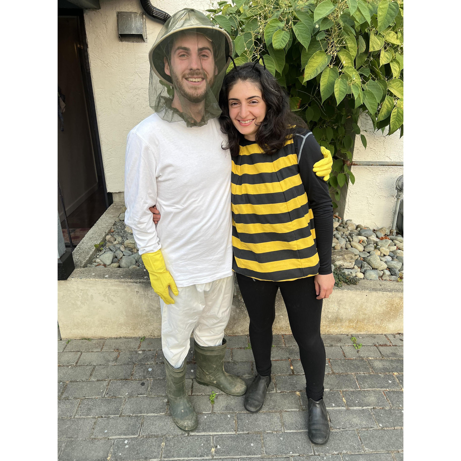 A beekeeper and a bee.