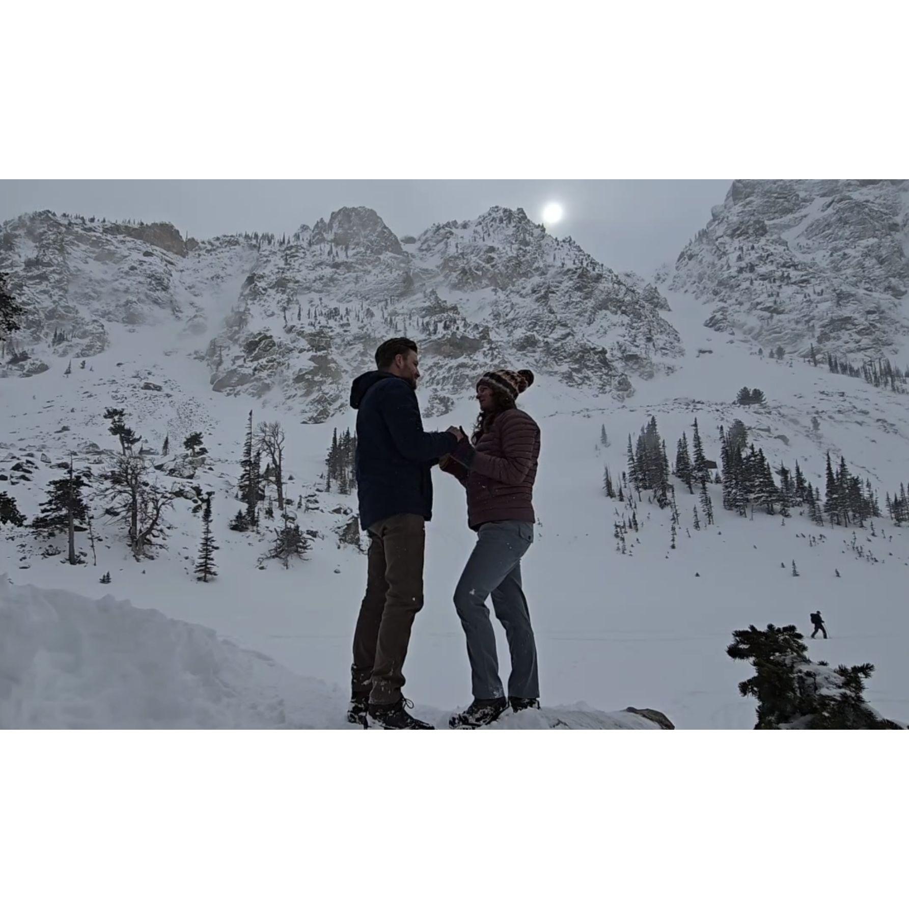 Todd proposing to Cassie in Rocky Mountain National Park. Don't let the look of the weather in this picture fool you; it was a magical winter day