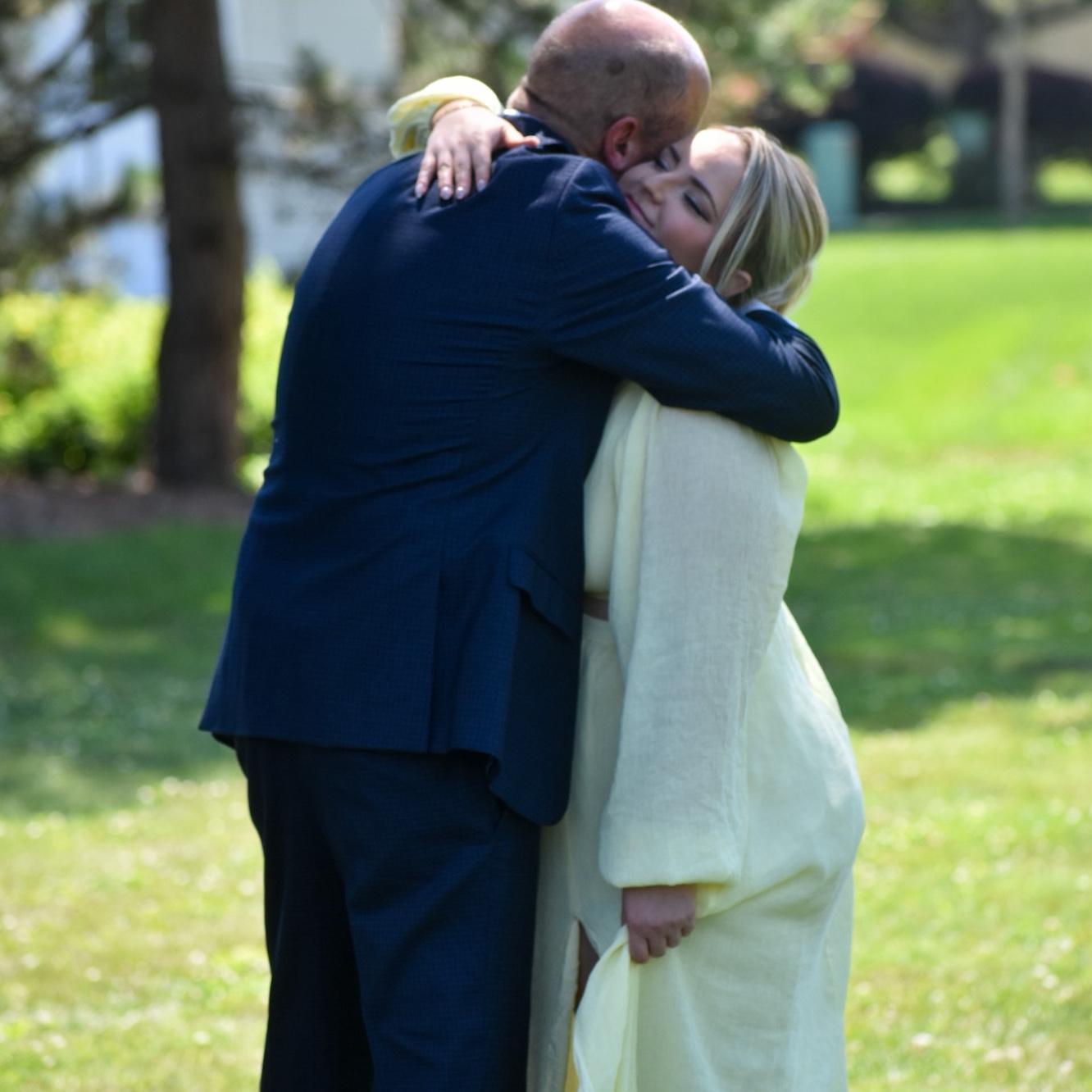 The father of the bride sharing a touching moment at his wedding.